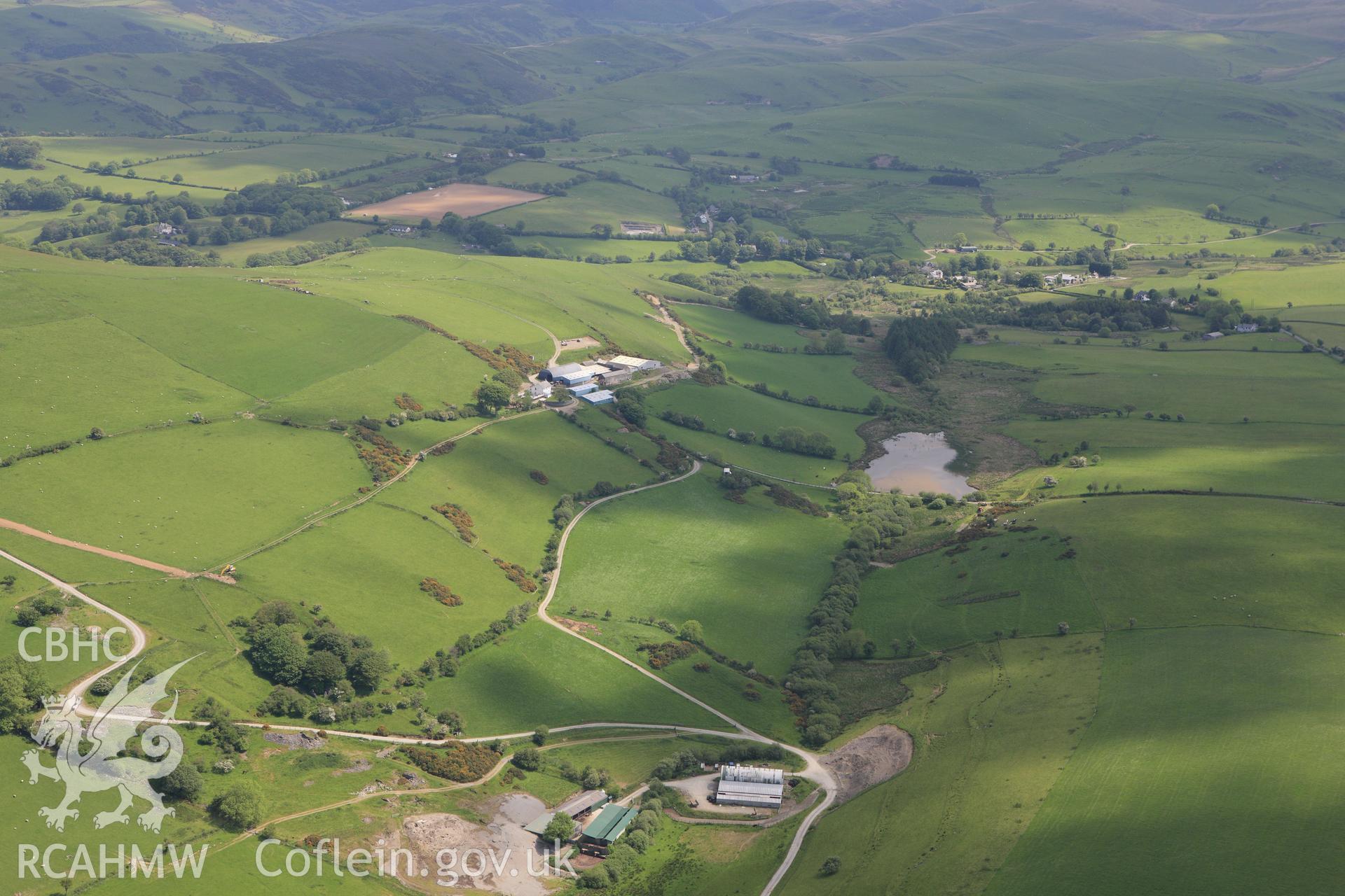 RCAHMW colour oblique aerial photograph of Mynydd Gorddu Farm. Taken on 02 June 2009 by Toby Driver