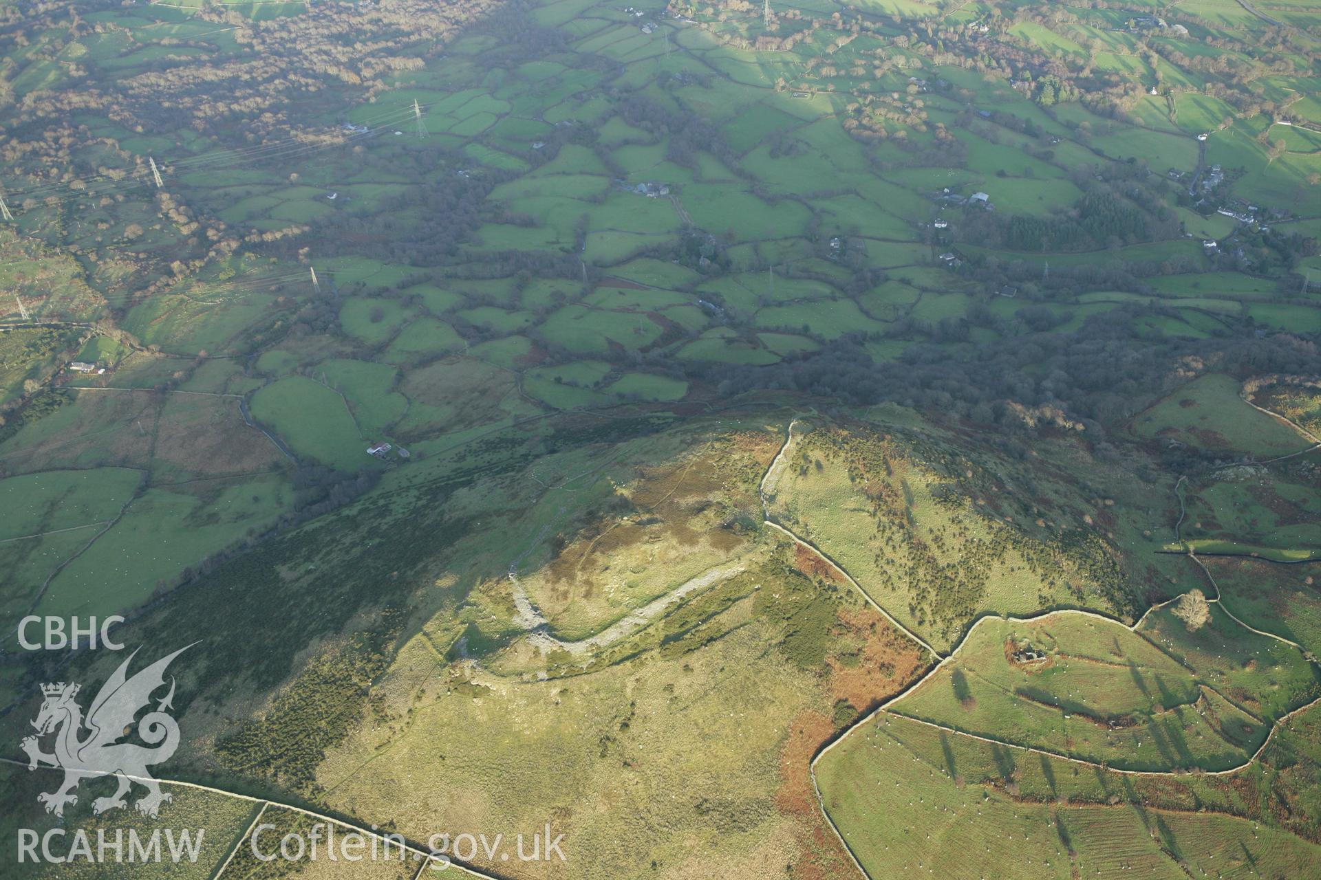 RCAHMW colour oblique aerial photograph of Pen-y-Gaer Hillfort. Taken on 10 December 2009 by Toby Driver