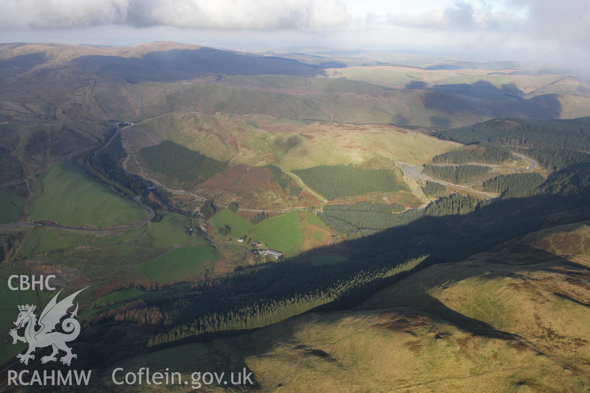 RCAHMW colour oblique aerial photograph of Esgair Lle Lead Mine, Eisteddfa Gurig, and the surrounding landscape from the south-west. Taken on 09 November 2009 by Toby Driver