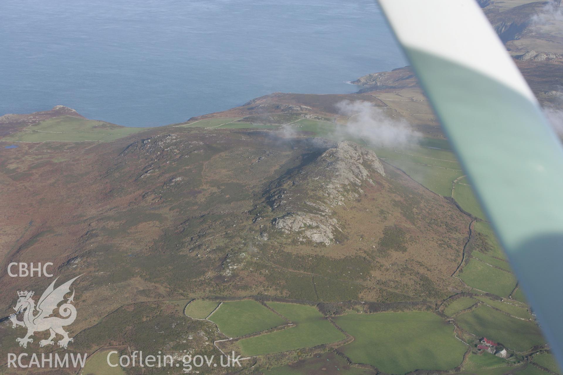 RCAHMW colour oblique aerial photograph of Carn Llidi Enclosures, St Davids. Taken on 28 January 2009 by Toby Driver