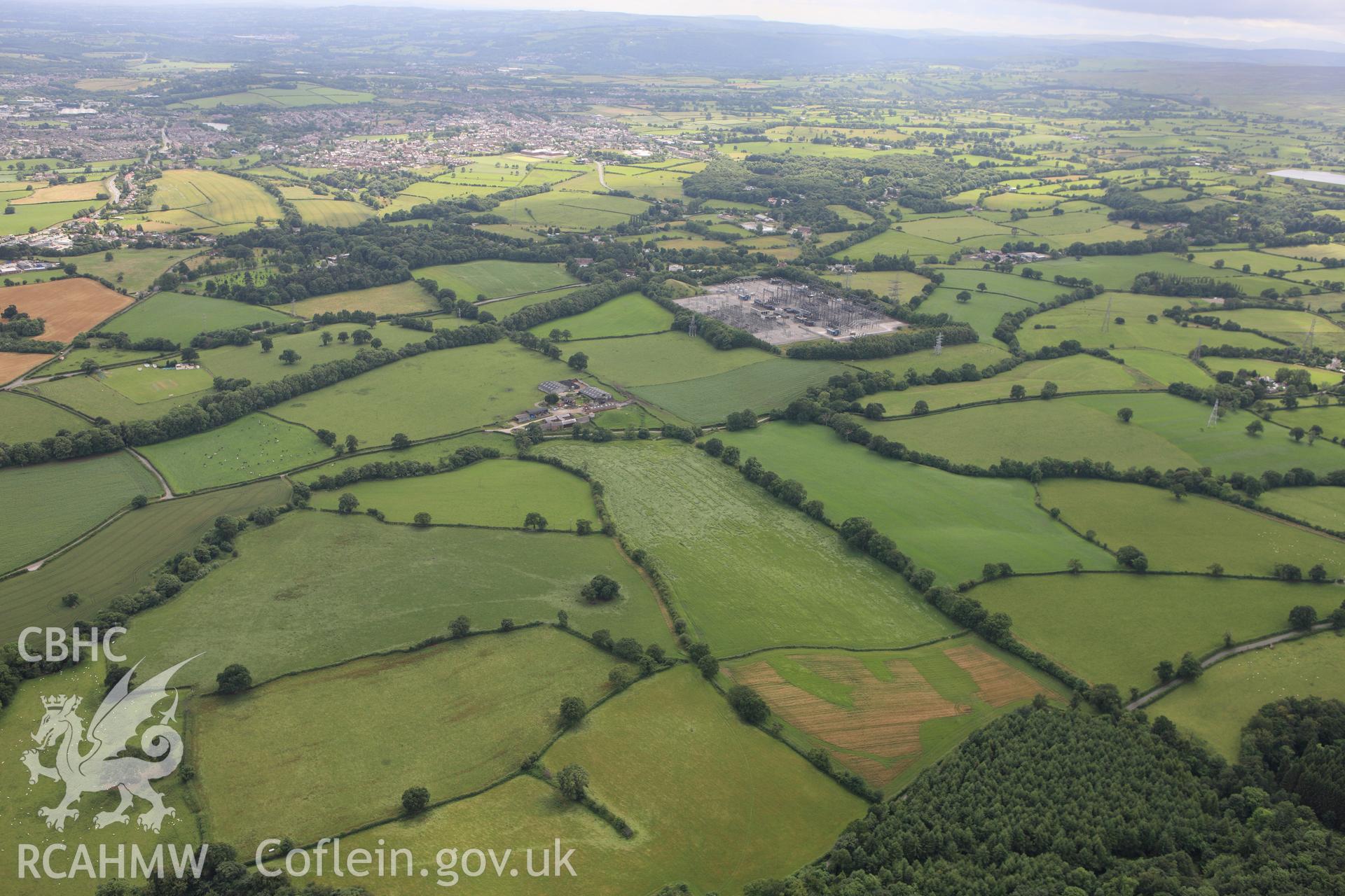 RCAHMW colour oblique aerial photograph of a section of Offa's Dyke at Cadwgan Hall extending from the River Clywedog to the railway. Taken on 08 July 2009 by Toby Driver