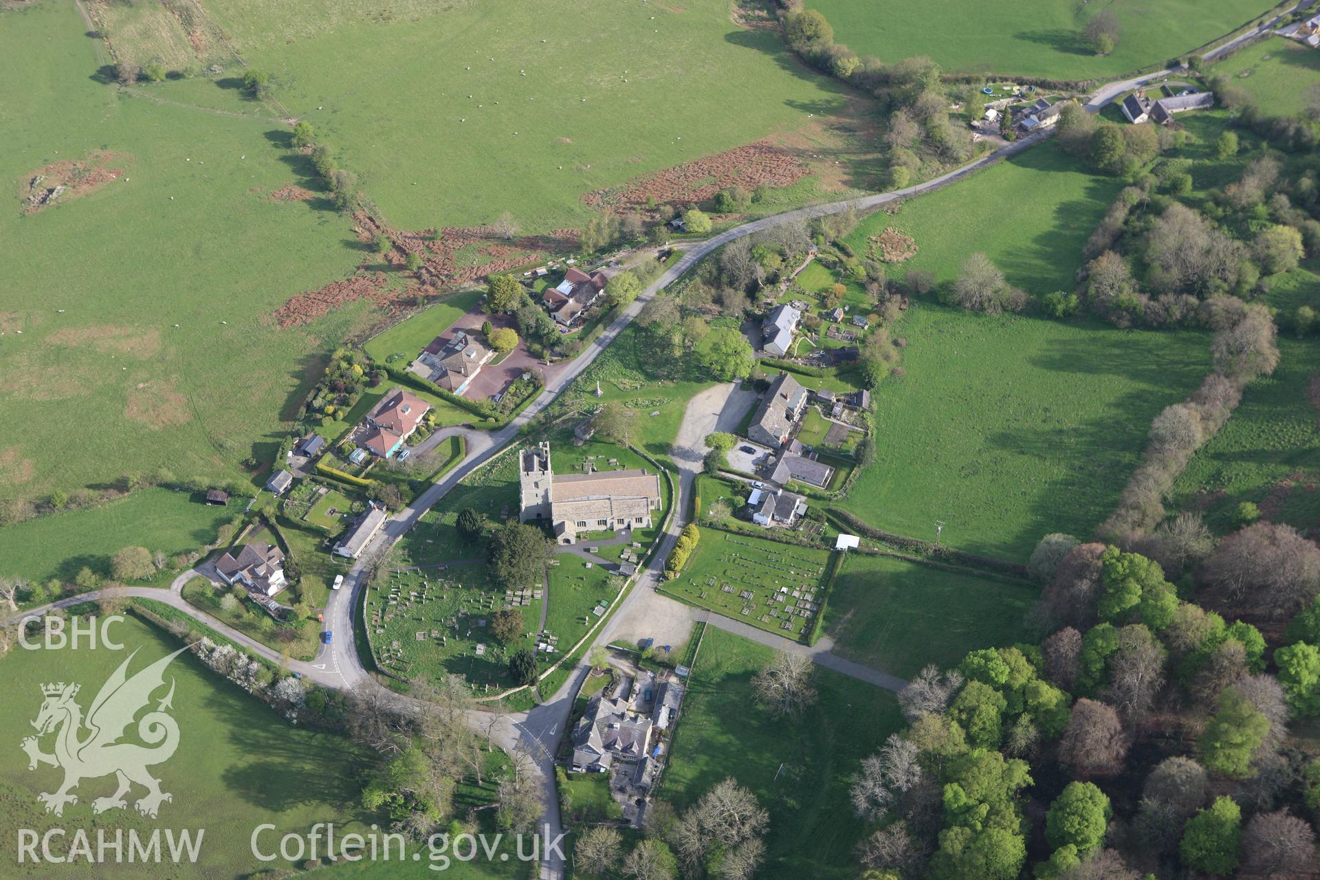 RCAHMW colour oblique aerial photograph of Old Radnor Castle, showing village and ringwork. Taken on 21 April 2009 by Toby Driver