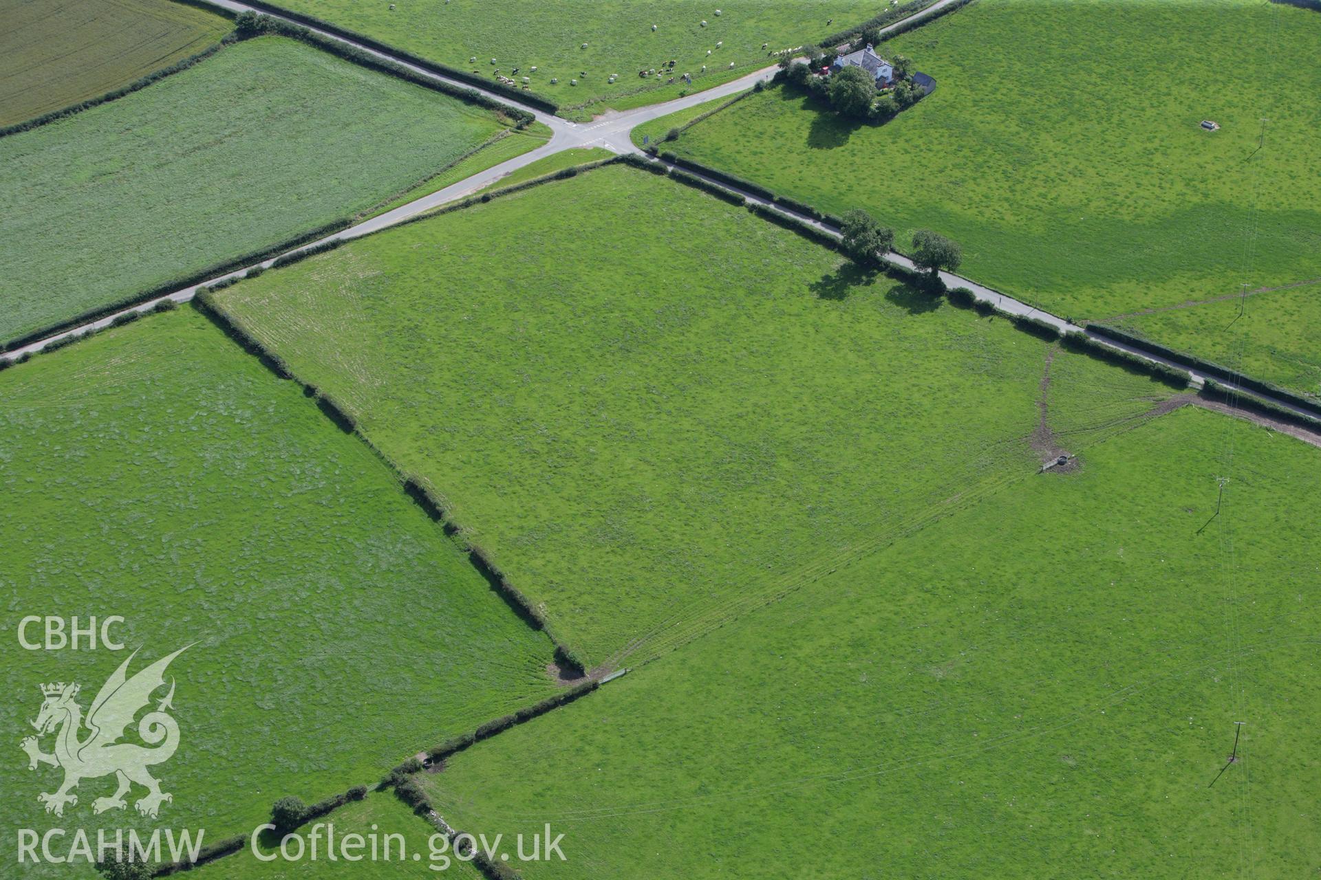 RCAHMW colour oblique aerial photograph of Ty-Uchaf Barrow. Taken on 30 July 2009 by Toby Driver