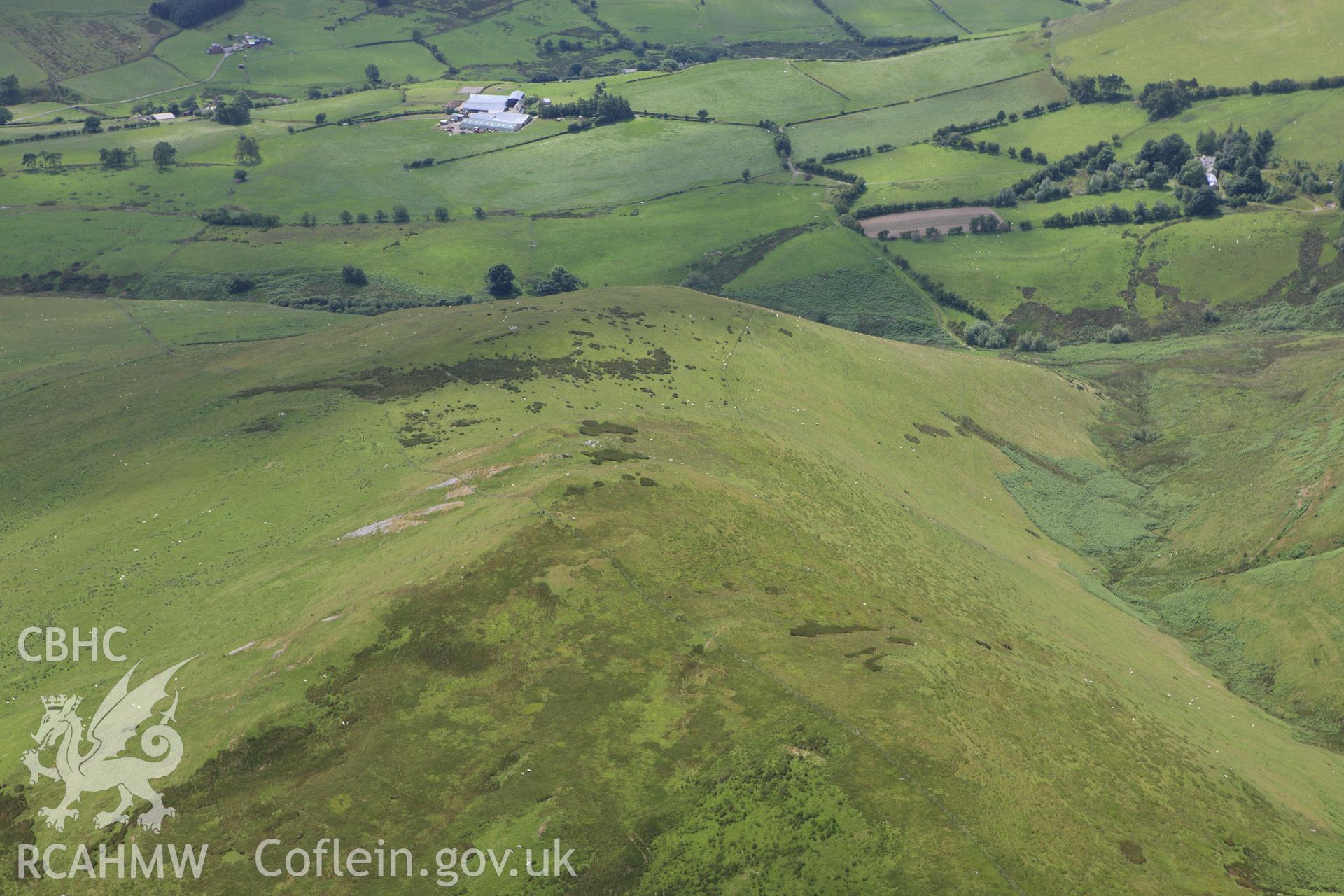 RCAHMW colour oblique aerial photograph of Foel Ddu Barrow. Taken on 08 July 2009 by Toby Driver