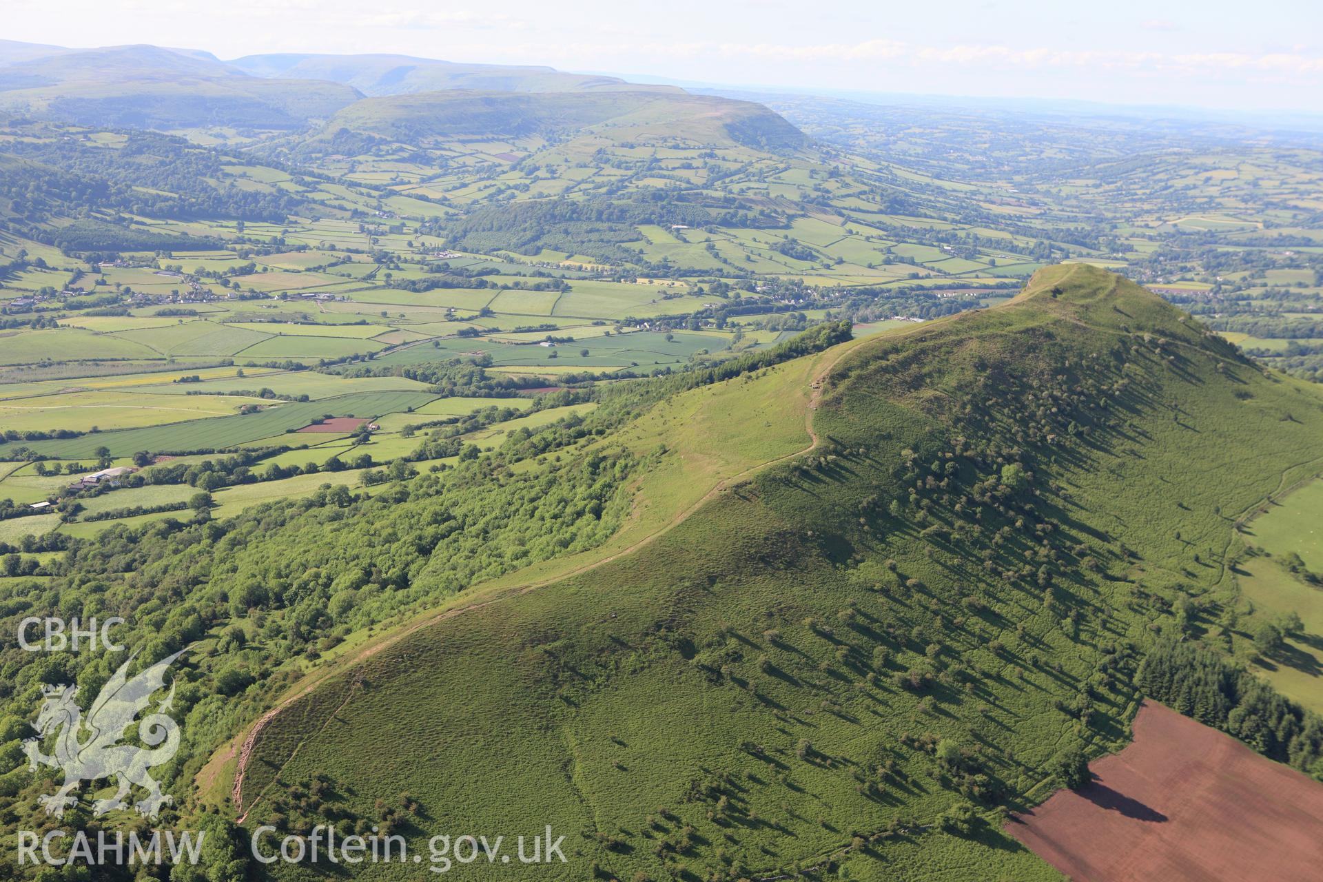 RCAHMW colour oblique aerial photograph of Skirrid Fawr Summit Enclosure. Taken on 11 June 2009 by Toby Driver