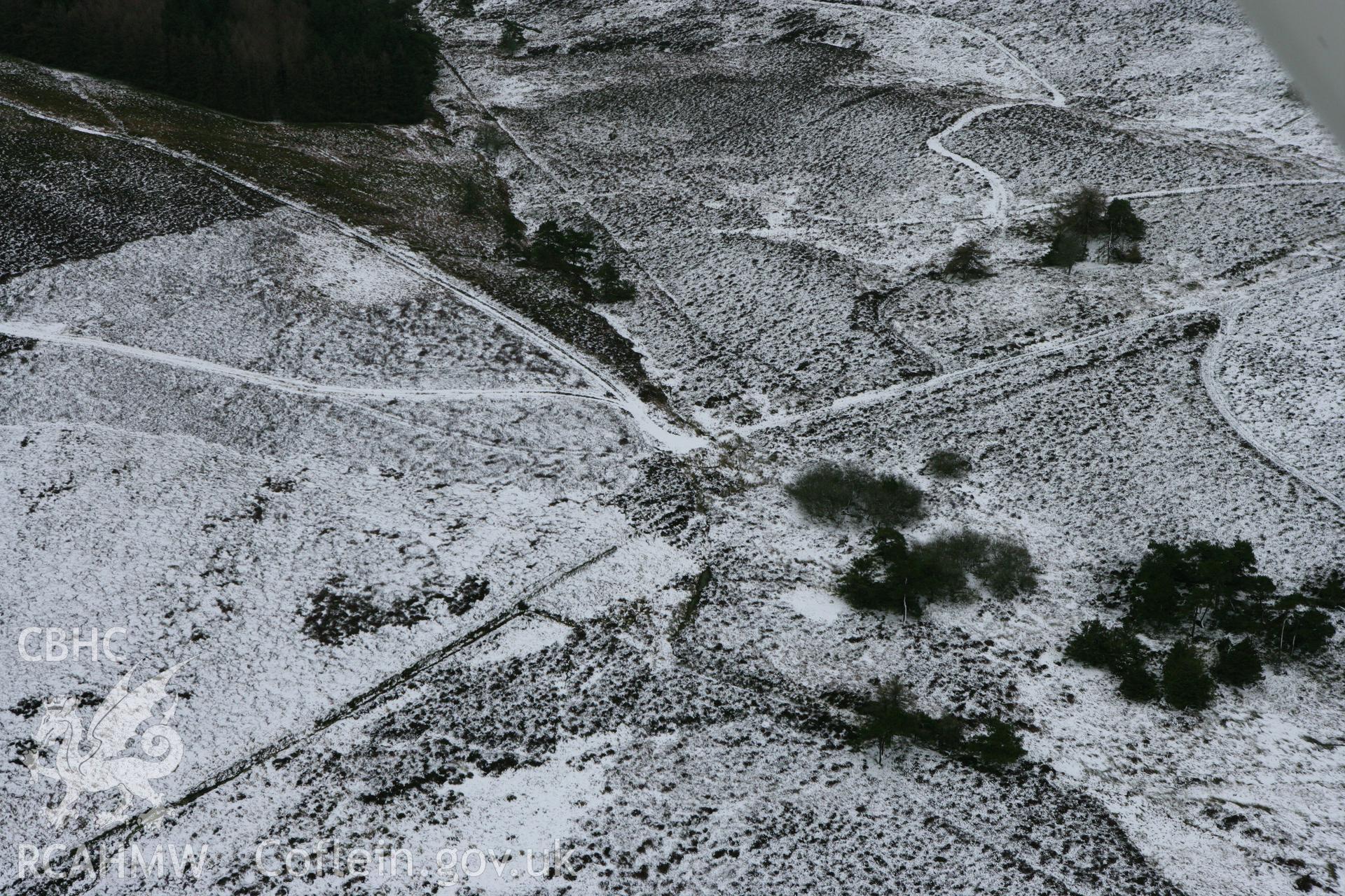 RCAHMW colour oblique photograph of Wilderness round barrow (Vivod mountain cairn). Taken by Toby Driver on 21/01/2009.