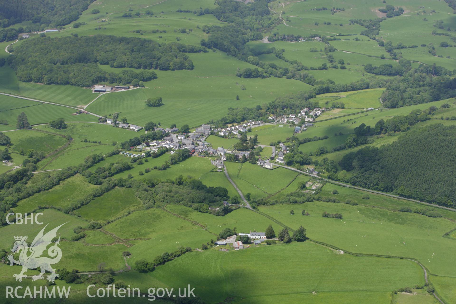 RCAHMW colour oblique aerial photograph of Pennal village in high view. Taken on 02 June 2009 by Toby Driver