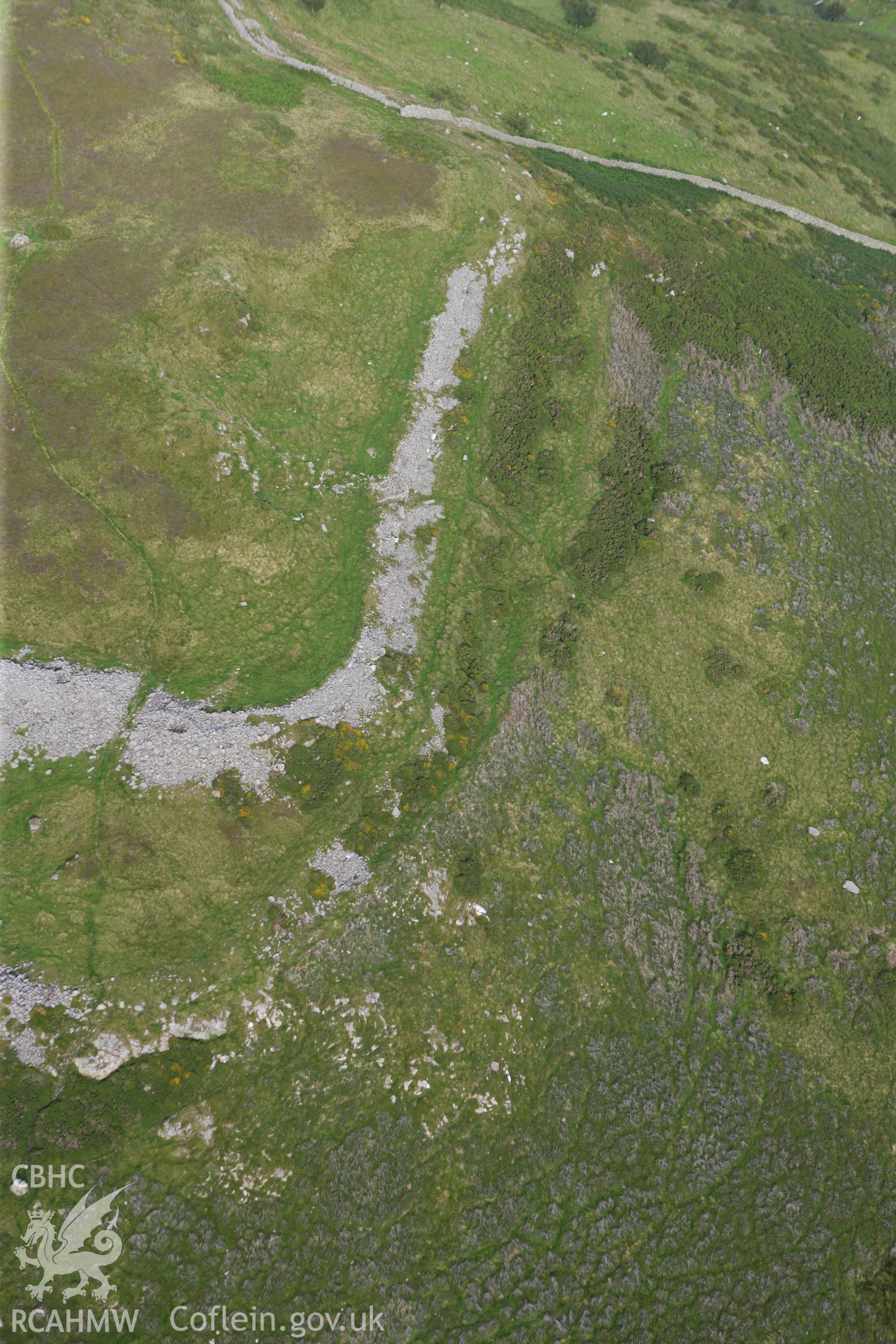 RCAHMW colour oblique aerial photograph of Pen-y-Gaer Hillfort. Taken on 06 August 2009 by Toby Driver