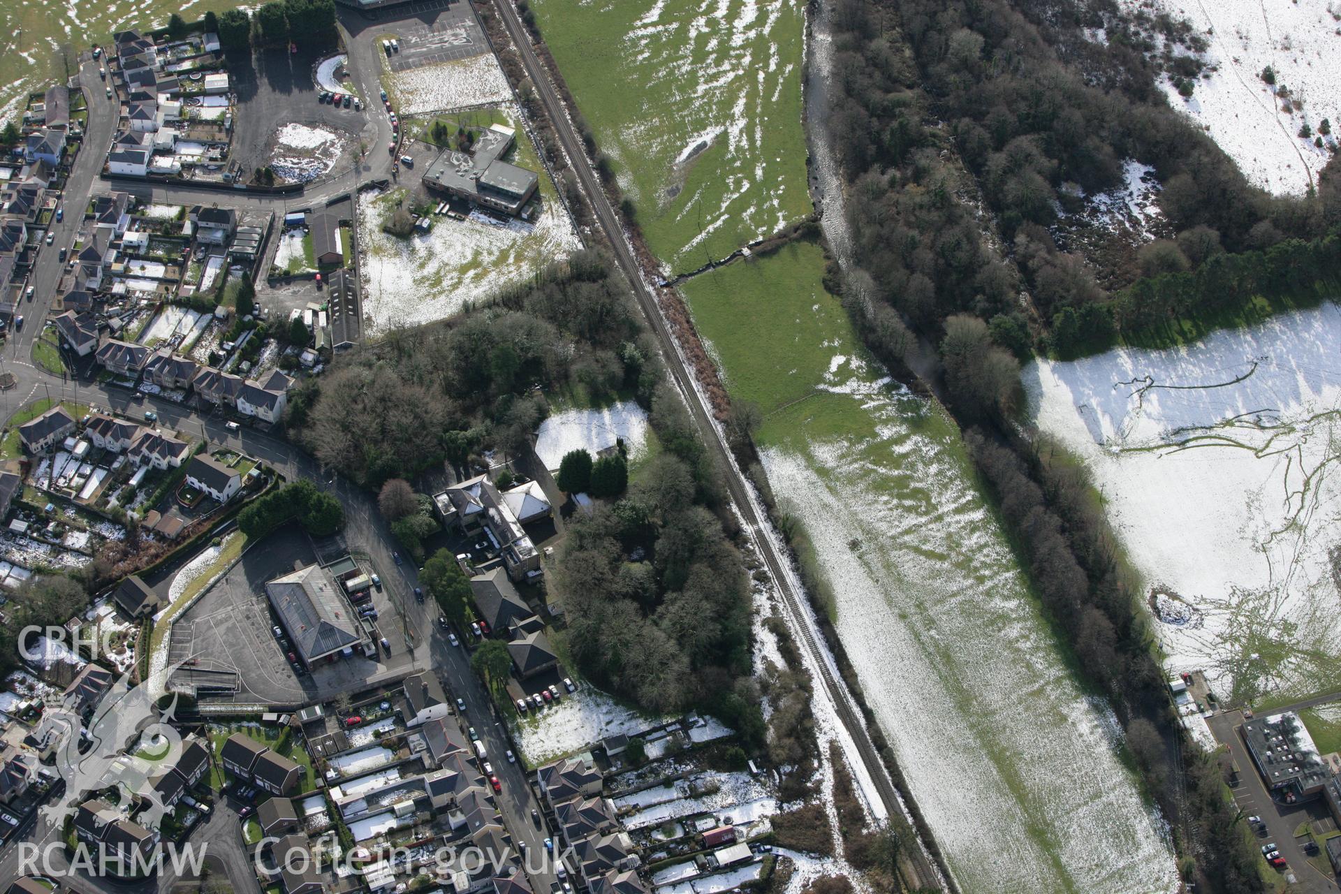 RCAHMW colour oblique photograph of Tir-y-Dail motte and bailey, Ammanford. Taken by Toby Driver on 06/02/2009.