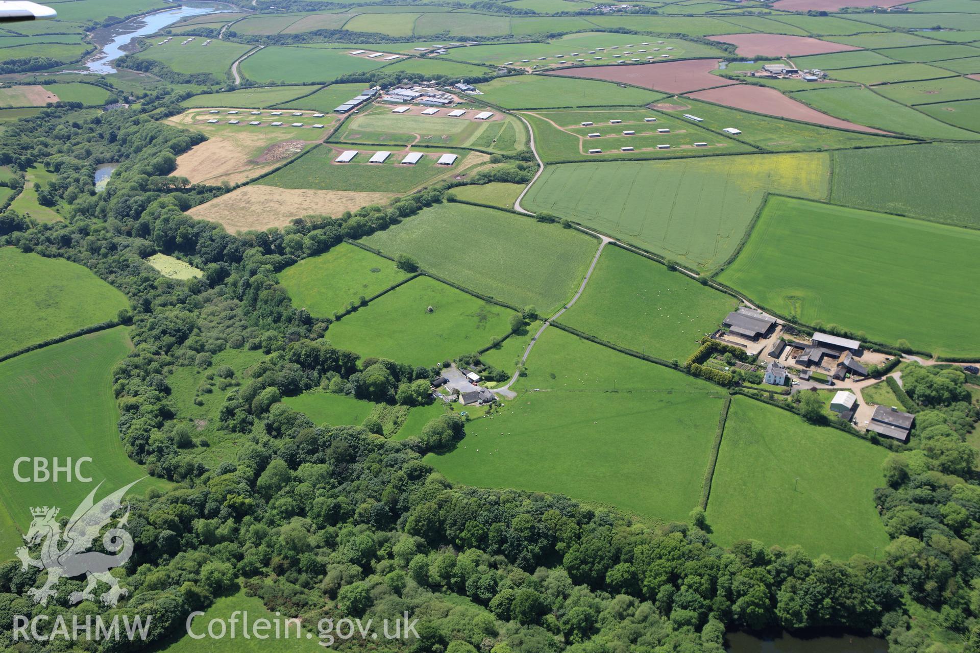 RCAHMW colour oblique aerial photograph of Syke Rath Promontory Fort. Taken on 01 June 2009 by Toby Driver