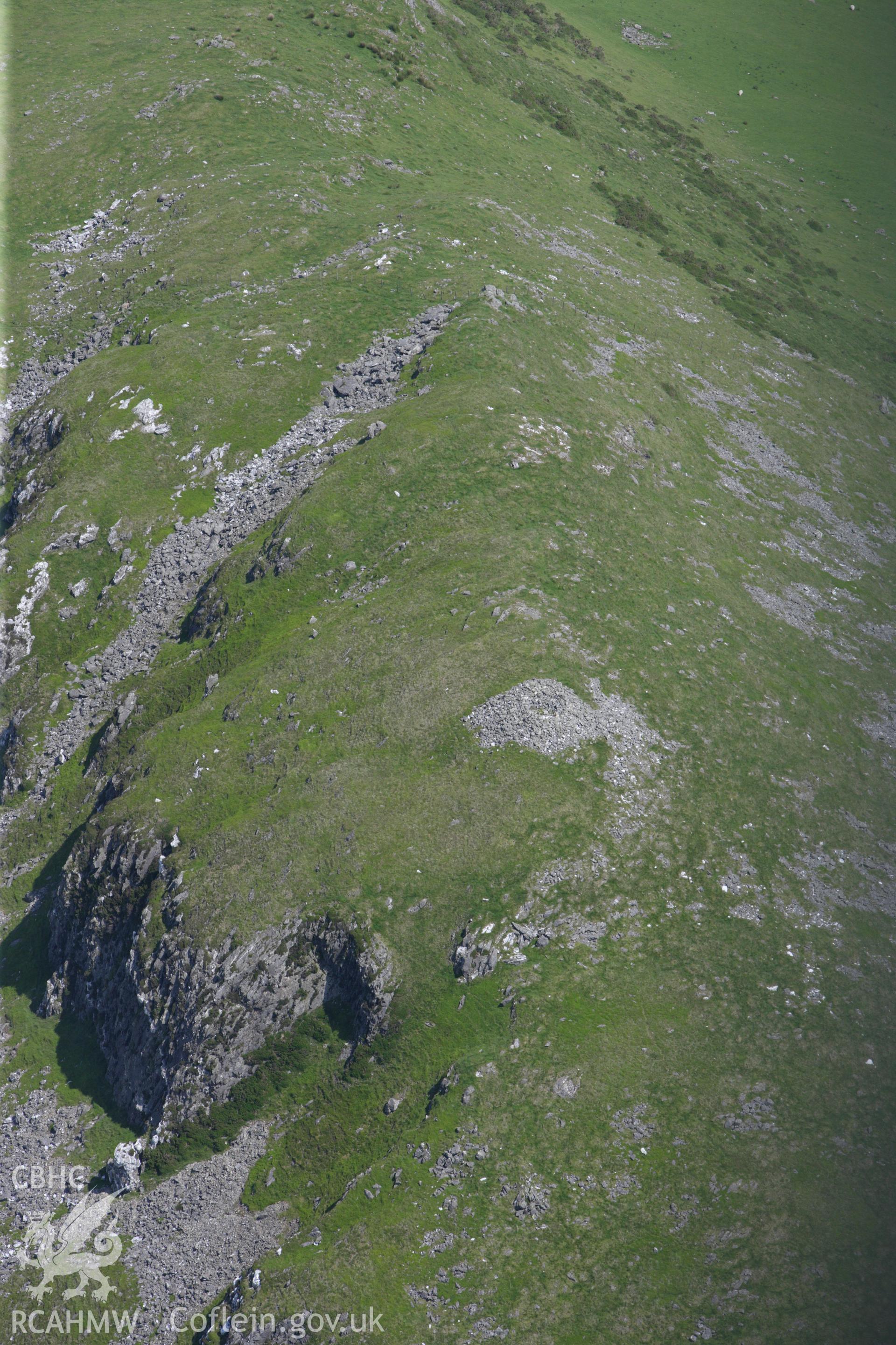 RCAHMW colour oblique aerial photograph of Craig Yr Aderyn Cairn. The cairn to the south. Taken on 02 June 2009 by Toby Driver