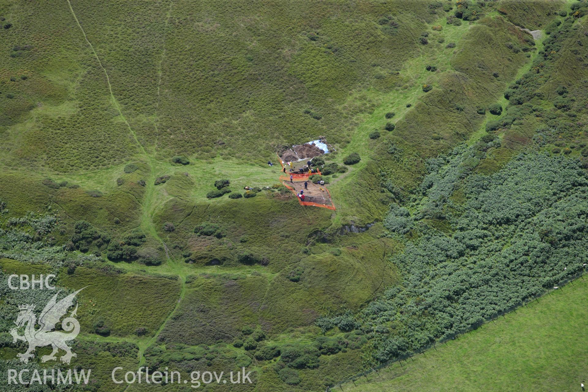 RCAHMW colour oblique aerial photograph of Moel-y-Gaer Hillfort, Llanbedr, with Bangor University excavations. Taken on 30 July 2009 by Toby Driver