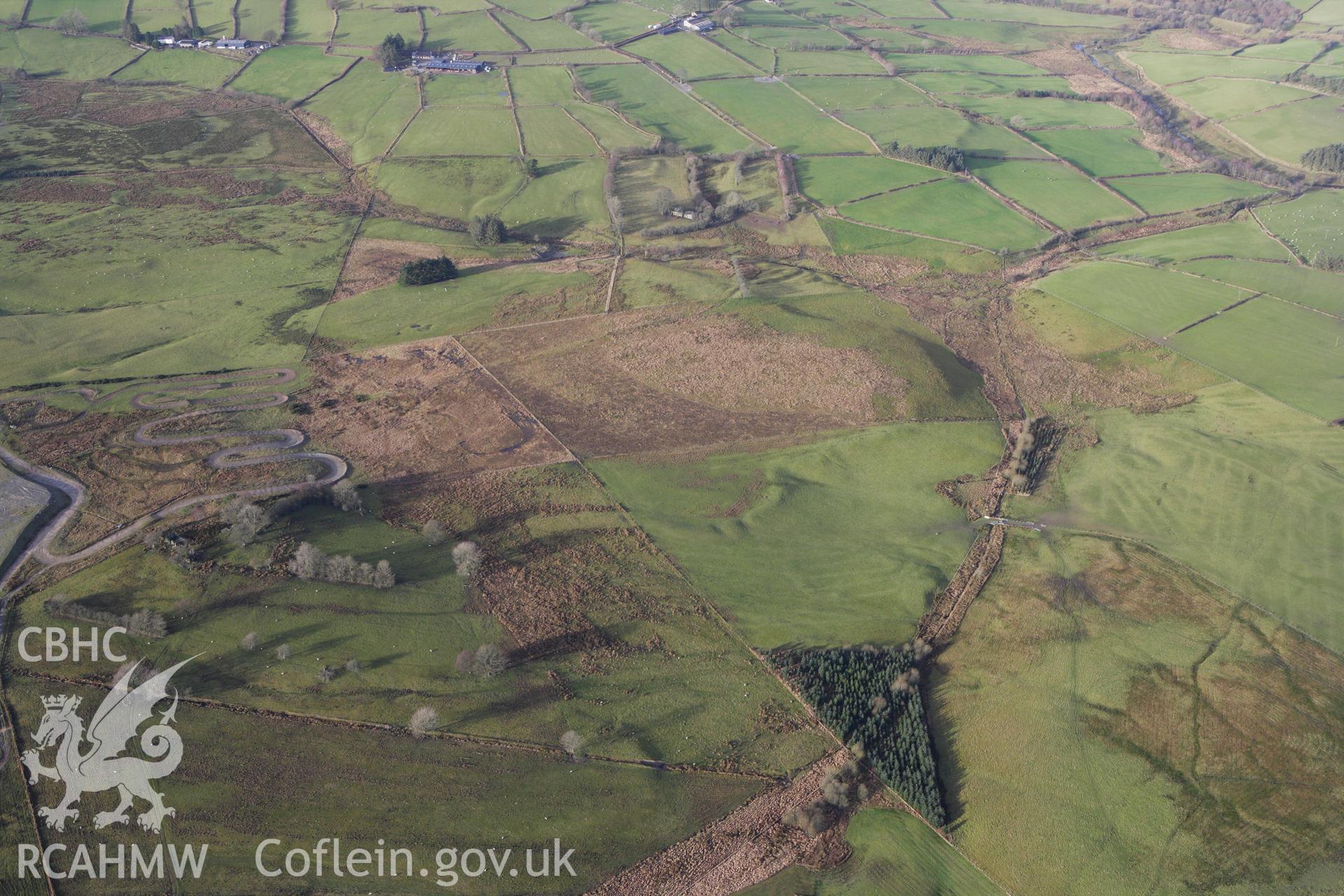 RCAHMW colour oblique aerial photograph of Cwm Nant Marching Camp, St Harmon. Taken on 10 December 2009 by Toby Driver