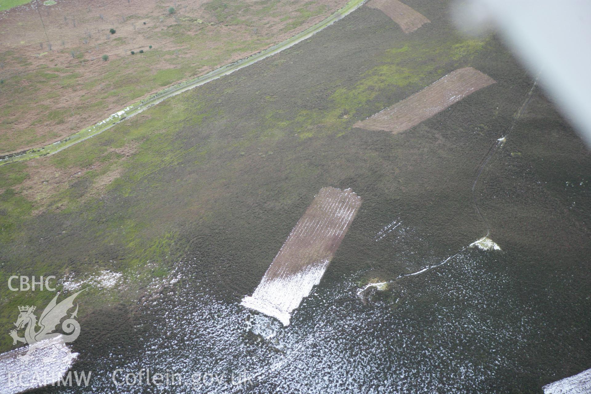 RCAHMW colour oblique photograph of Moel Gyw round barrow. Taken by Toby Driver on 21/01/2009.