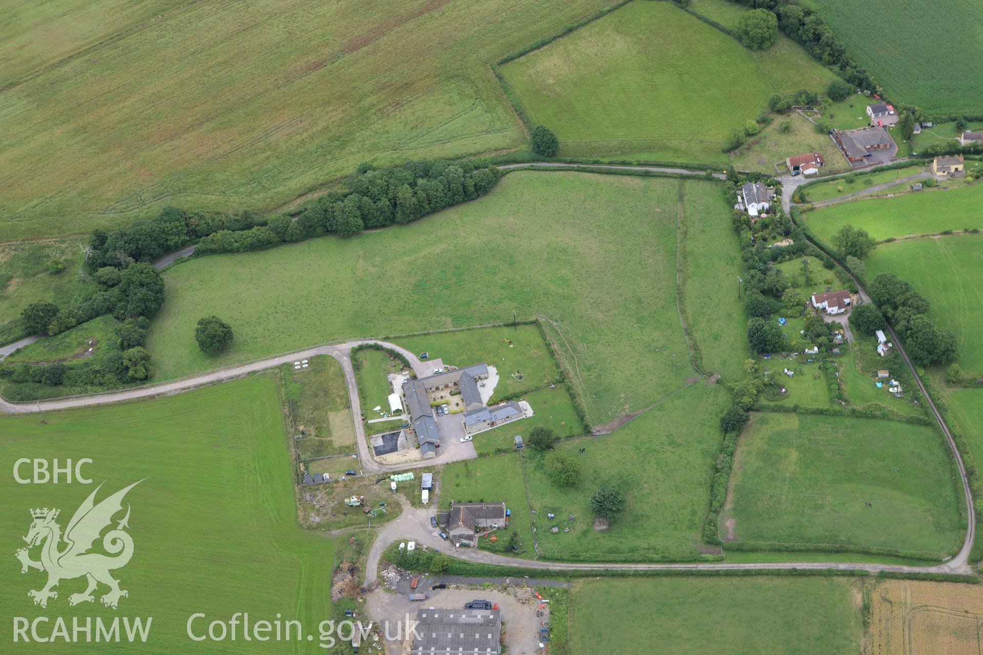 RCAHMW colour oblique aerial photograph of Bishton Castle. Taken on 09 July 2009 by Toby Driver