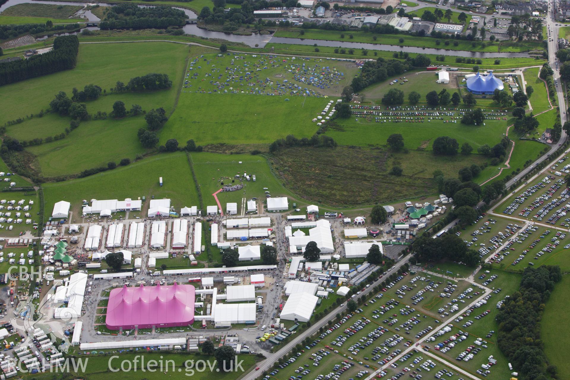 RCAHMW colour oblique aerial photograph of the site of the Eistedddfod at Bala in 1997 and 2009. Taken on 06 August 2009 by Toby Driver