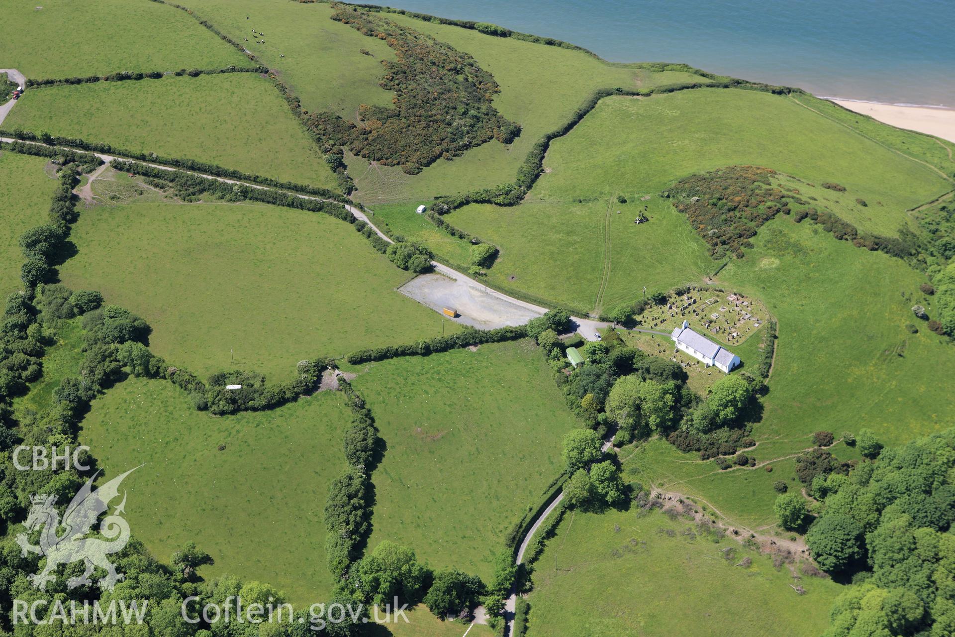 RCAHMW colour oblique aerial photograph of St Michael's Church, Llanfihangel Penbryn. Taken on 01 June 2009 by Toby Driver