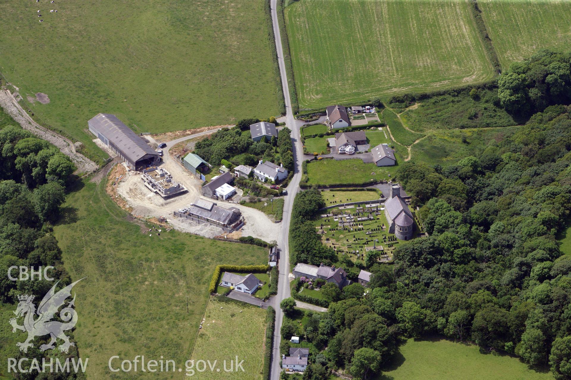 RCAHMW colour oblique aerial photograph of Llanddeiniol Village. Taken on 16 June 2009 by Toby Driver