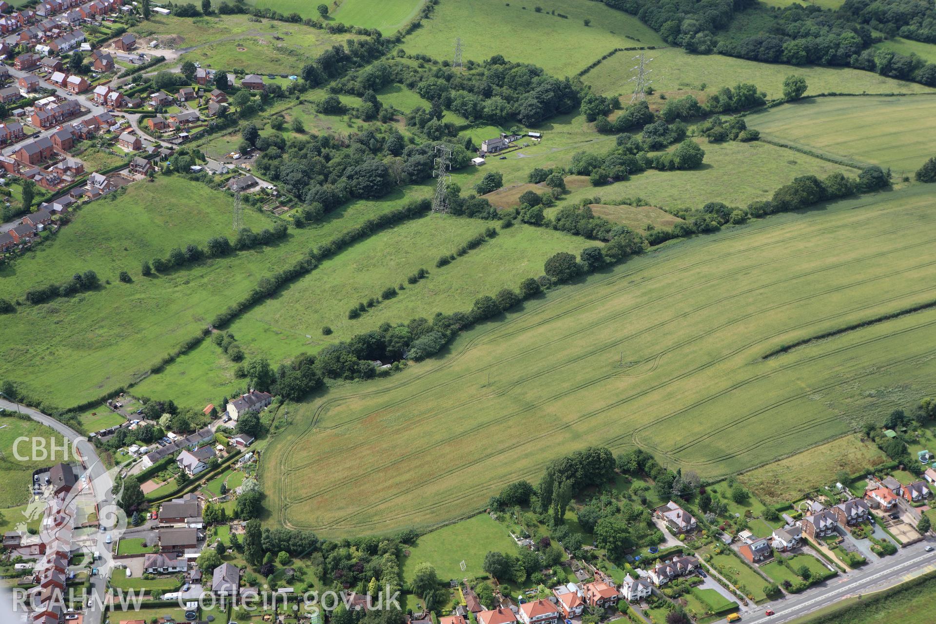 RCAHMW colour oblique aerial photograph of a section of Offa's Dyke north and south of of Bryn yr Owen Colliery. Taken on 08 July 2009 by Toby Driver