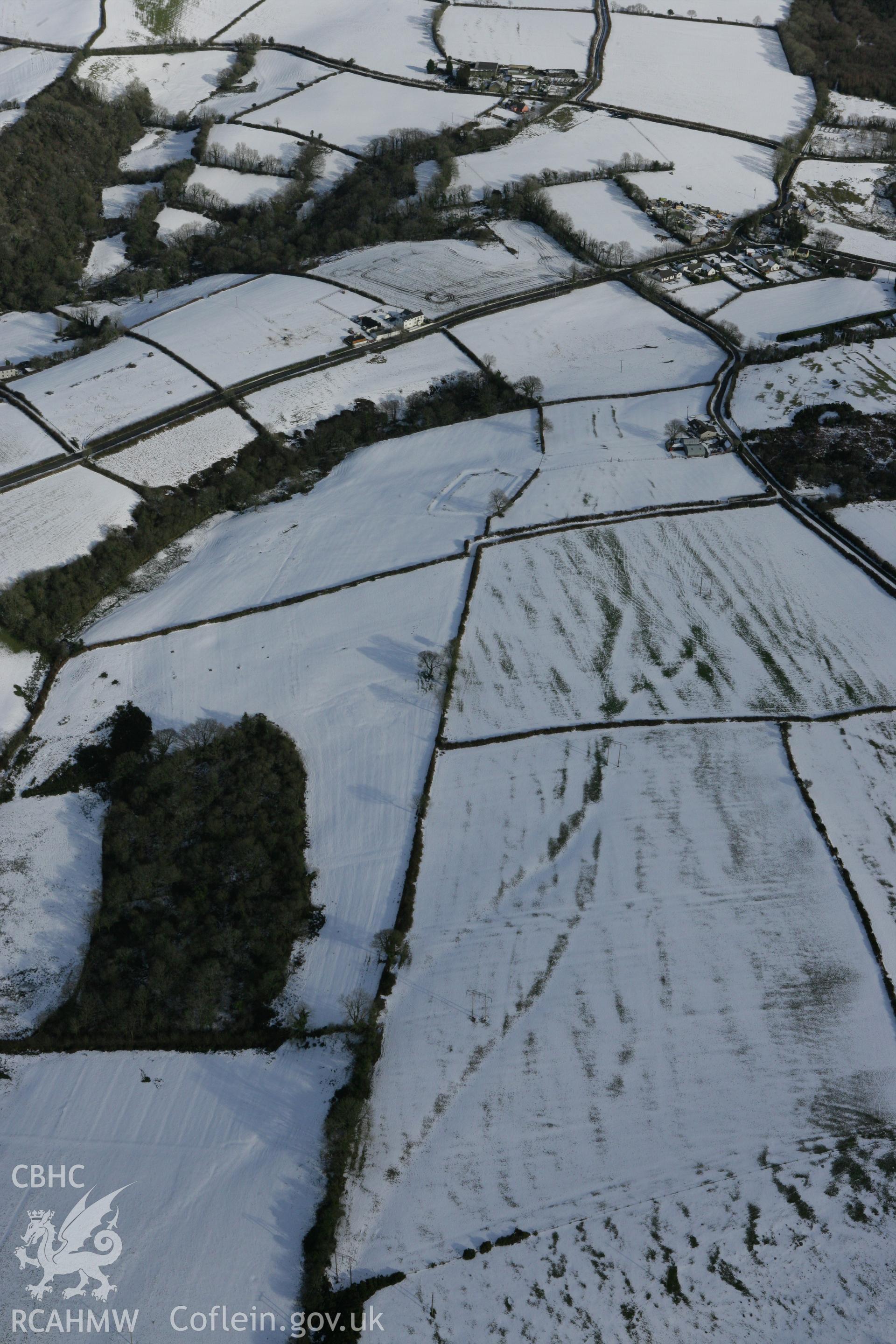RCAHMW colour oblique photograph of Bryn Cywyn defended enclosure. Taken by Toby Driver on 06/02/2009.
