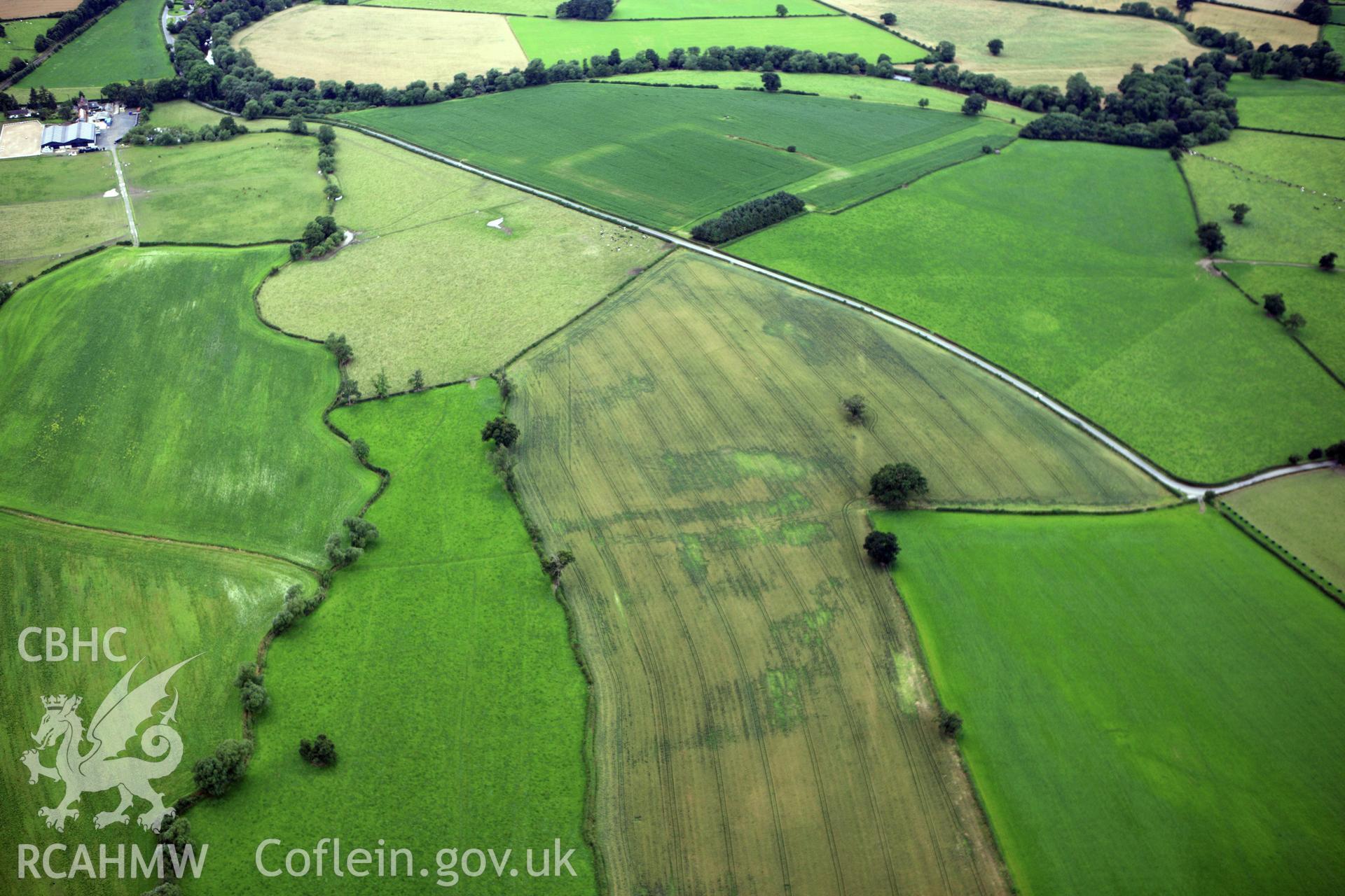 RCAHMW colour oblique aerial photograph of Forden Gaer Roman Camp. Taken on 23 July 2009 by Toby Driver