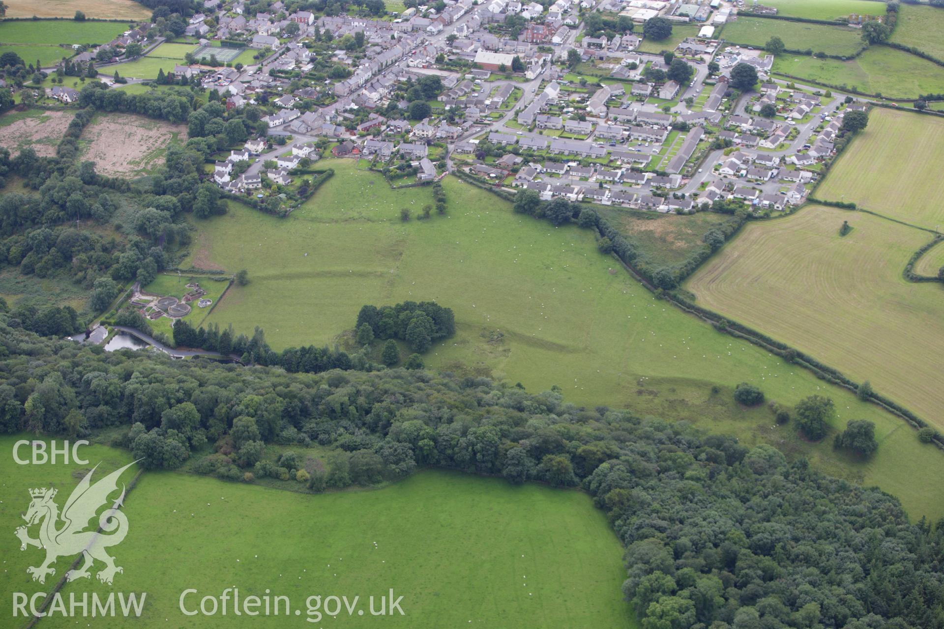 RCAHMW colour oblique aerial photograph of Coed Trefraith Enclosure. Taken on 30 July 2009 by Toby Driver