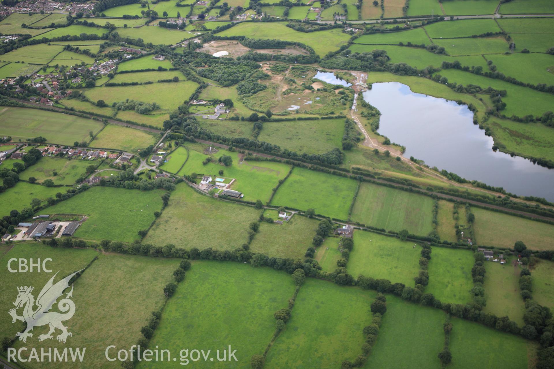 RCAHMW colour oblique aerial photograph of two sections of Wat's Dyke between Clawdd Offa and Pigeon House Farm. Taken on 30 July 2009 by Toby Driver