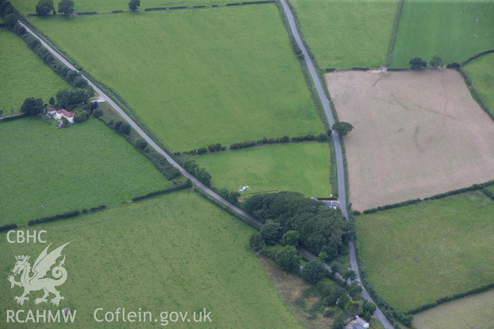 RCAHMW colour oblique photograph of Bryn Digrif round barrows. Taken by Toby Driver on 30/07/2009.