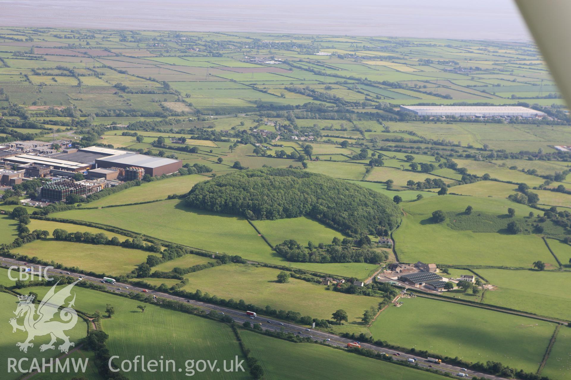 RCAHMW colour oblique aerial photograph of Wilcrick Hill Defended Enclosure. Taken on 11 June 2009 by Toby Driver