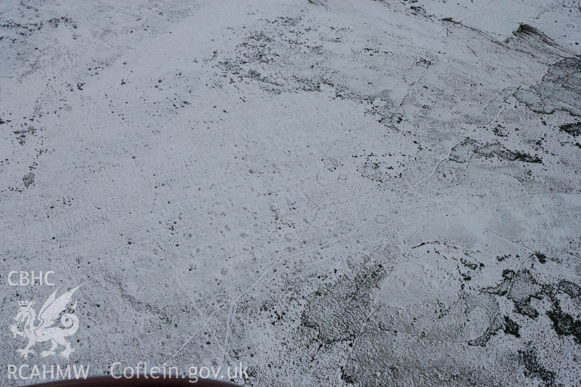 RCAHMW colour oblique photograph of Carn Ingli common hut circles. Taken by Toby Driver on 06/02/2009.