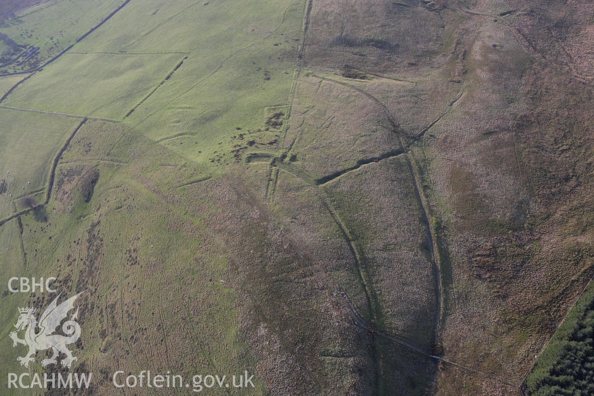 RCAHMW colour oblique aerial photograph of mine workings at Esgairmwyn Lead Mine and leat complex. Taken on 09 November 2009 by Toby Driver