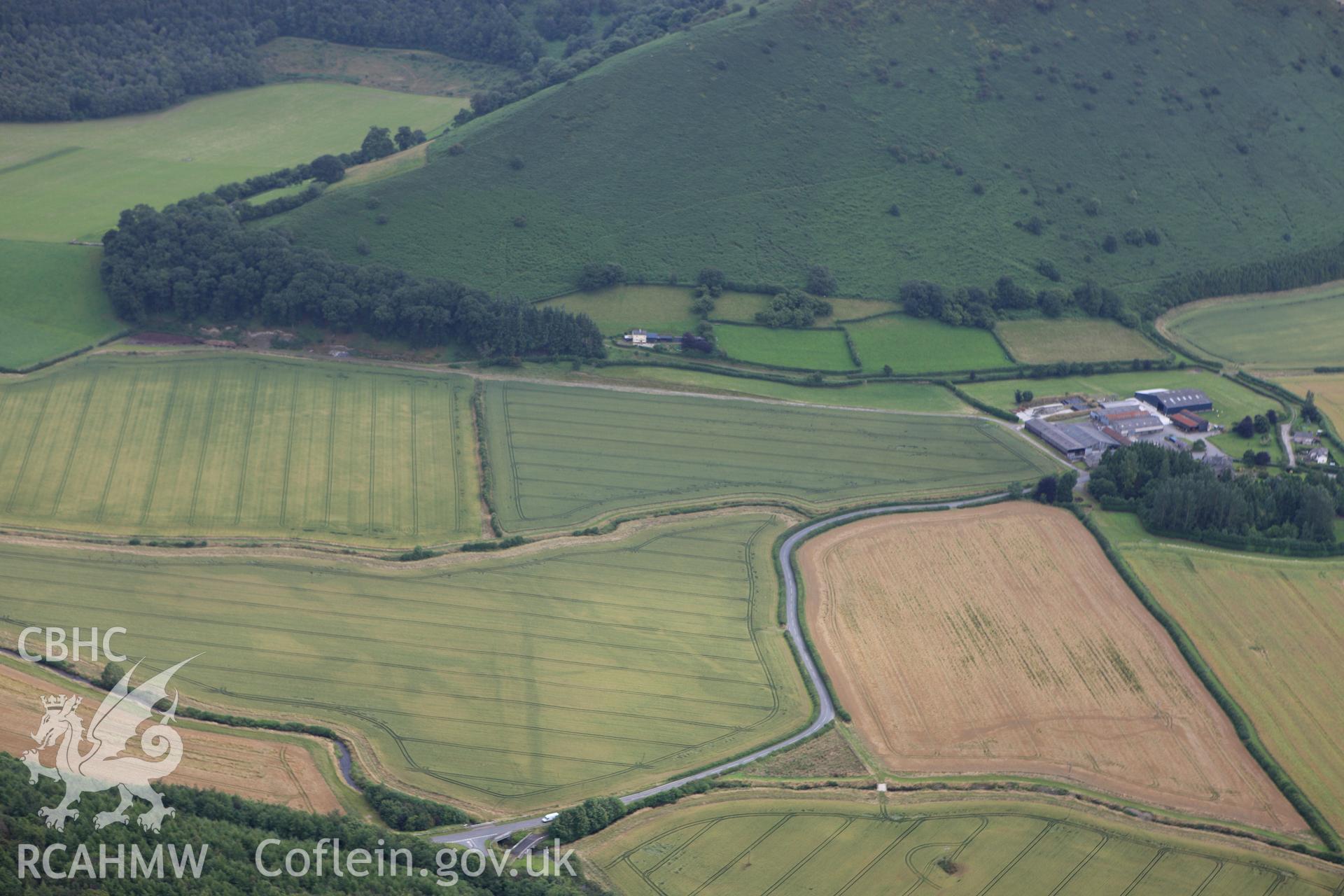 RCAHMW colour oblique aerial photograph of Ditchyeld Bridge Defended Enclosure. Taken on 23 July 2009 by Toby Driver