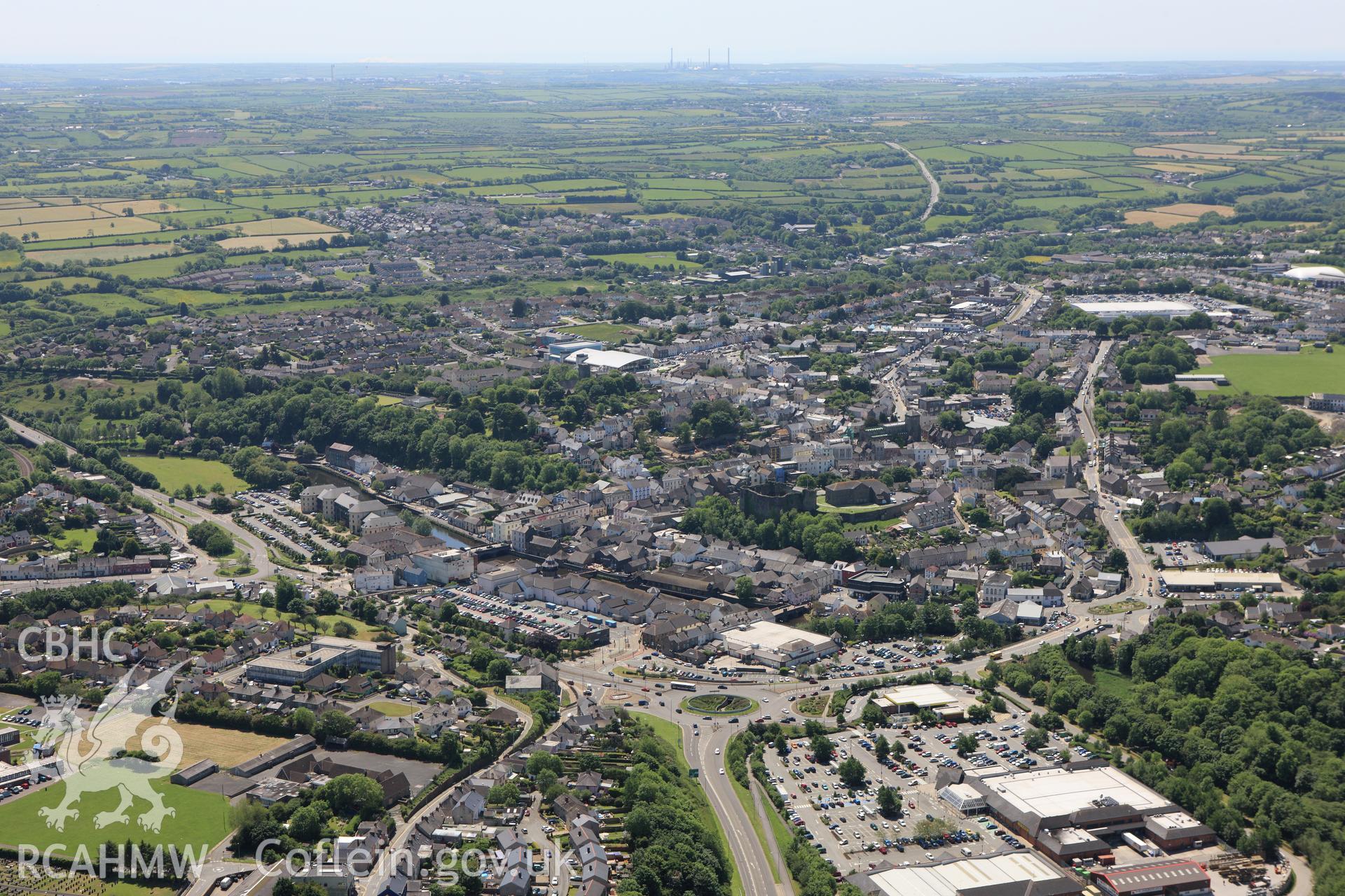 RCAHMW colour oblique aerial photograph of general view including Haverfordwest Castle. Taken on 01 June 2009 by Toby Driver