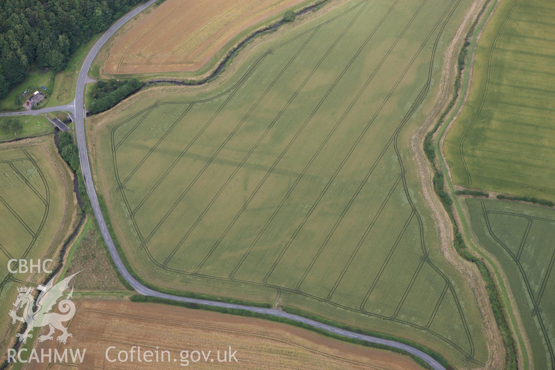 RCAHMW colour oblique aerial photograph of Ditchyeld Bridge Defended Enclosure. Taken on 23 July 2009 by Toby Driver