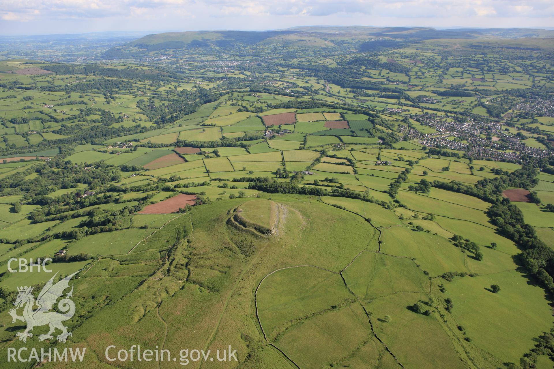 RCAHMW colour oblique aerial photograph of Crug Hywel Camp. Taken on 11 June 2009 by Toby Driver