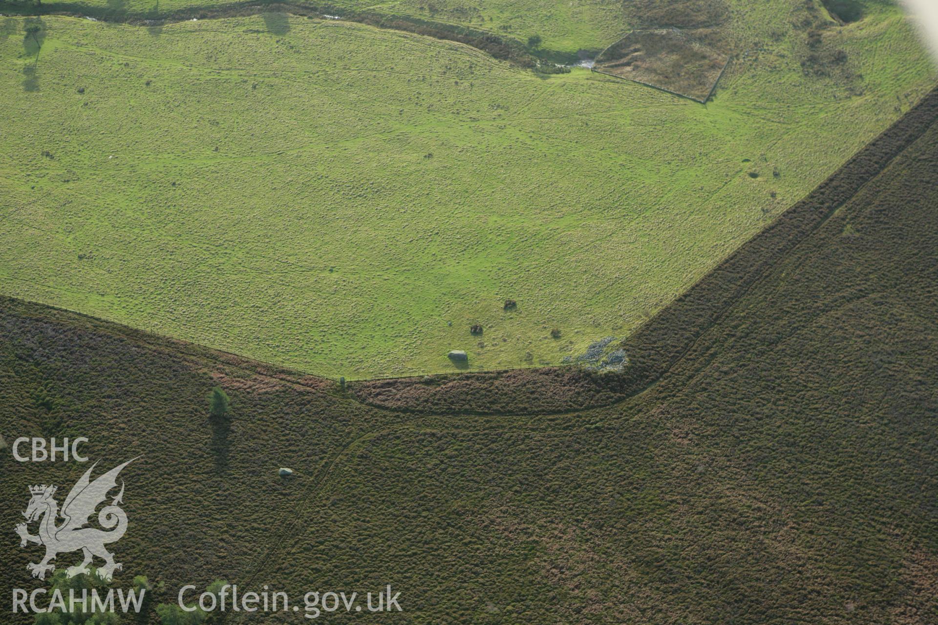 RCAHMW colour oblique aerial photograph of Creigiau Eglwyseg Cairn. Taken on 10 December 2009 by Toby Driver