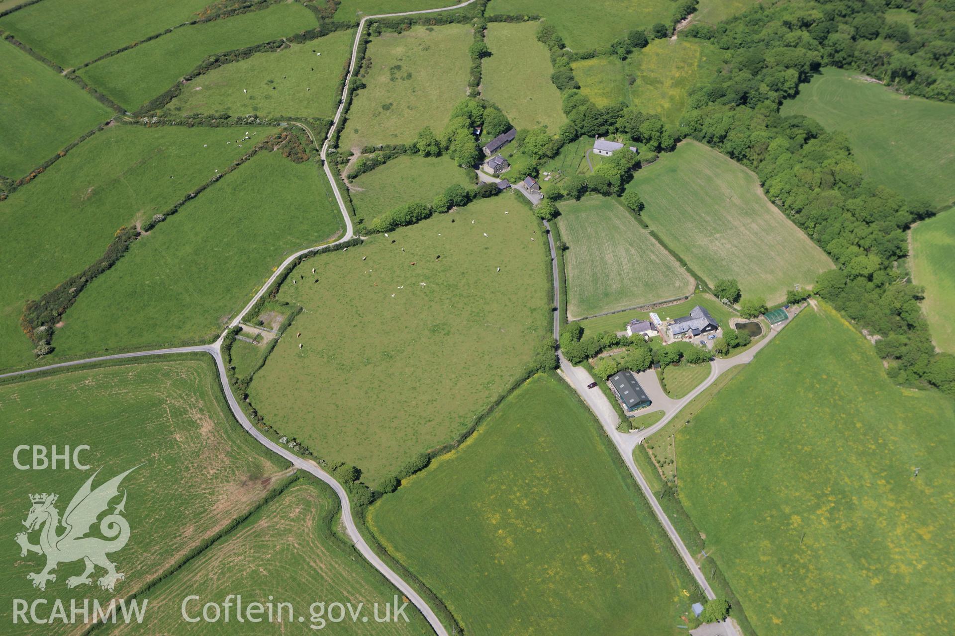 RCAHMW colour oblique aerial photograph of St. Tysilio's Church, near Nanternis, Llandysiliogogo. Taken on 01 June 2009 by Toby Driver