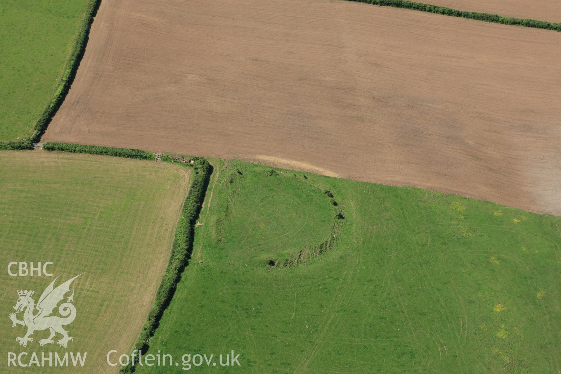 RCAHMW colour oblique aerial photograph of Ford Camp showing ploughing. Taken on 01 June 2009 by Toby Driver