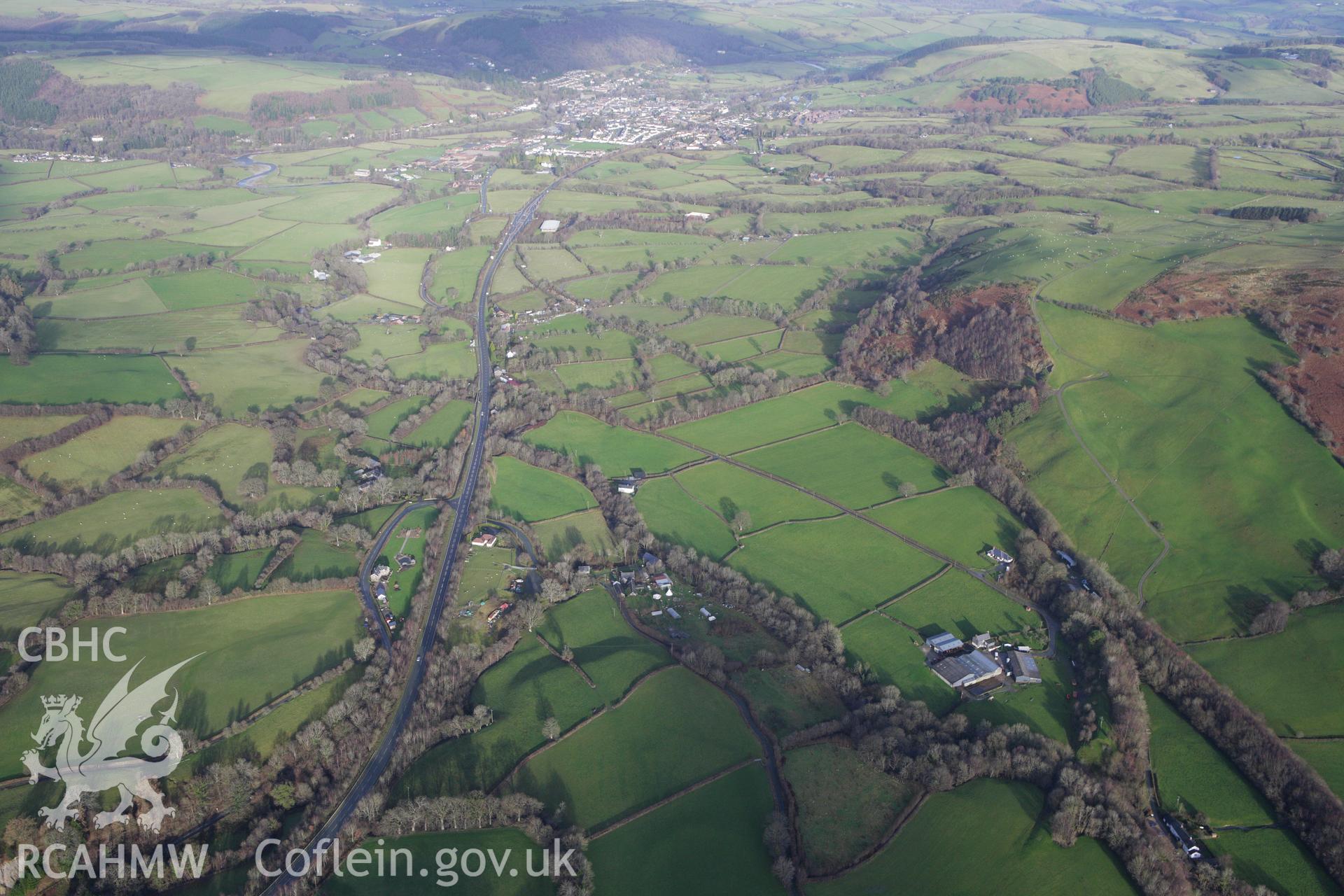 RCAHMW colour oblique aerial photograph of a section of the dismantled Manchester and Milford Railway between Llangurig and Llanidloes. Taken on 10 December 2009 by Toby Driver