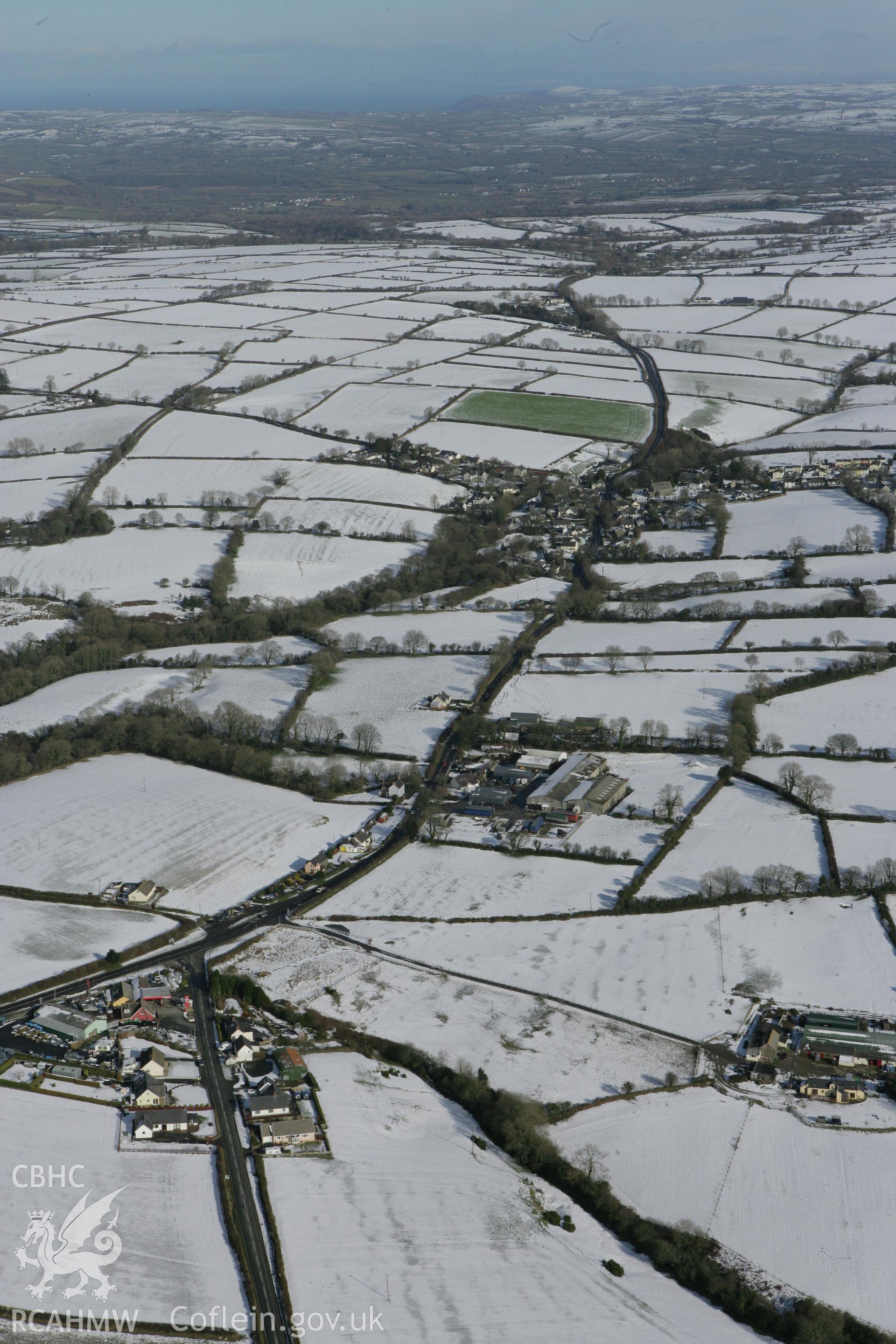 RCAHMW colour oblique photograph of Eglwyswrw village, from the south-west. Taken by Toby Driver on 06/02/2009.