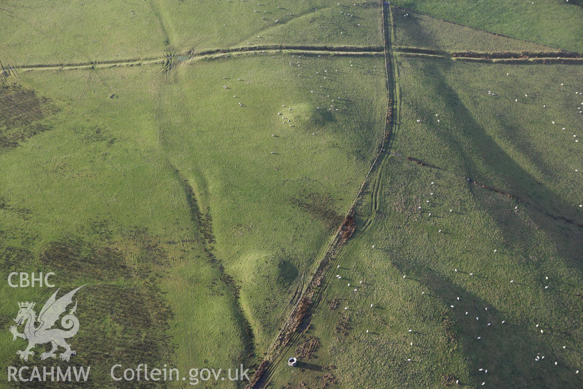 RCAHMW colour oblique aerial photograph of Two Tumps Dyke II and nearby barrows. Taken on 10 December 2009 by Toby Driver