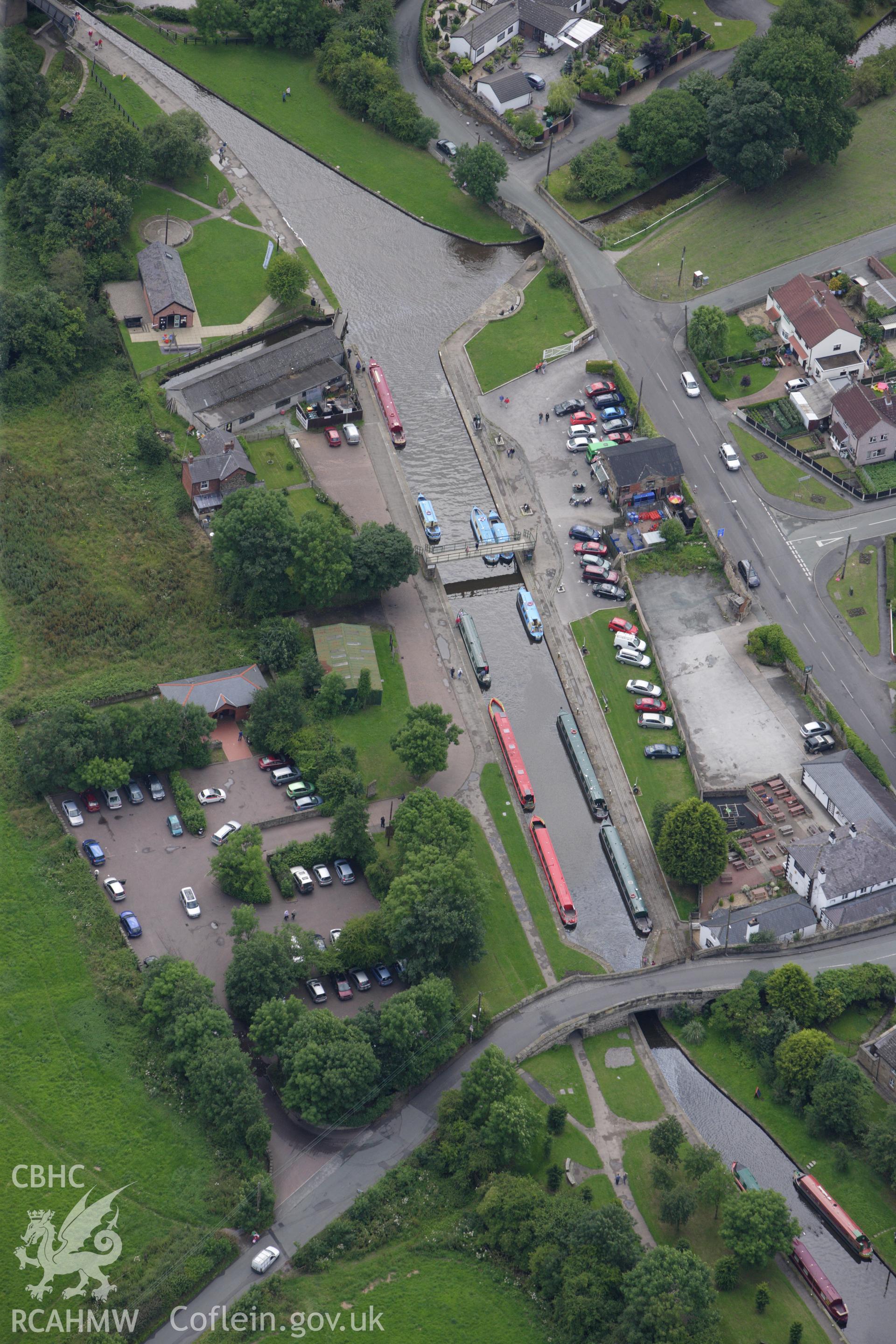 RCAHMW colour oblique aerial photograph of Trefor Wharf and Basin, Llangollen Canal. Taken on 08 July 2009 by Toby Driver