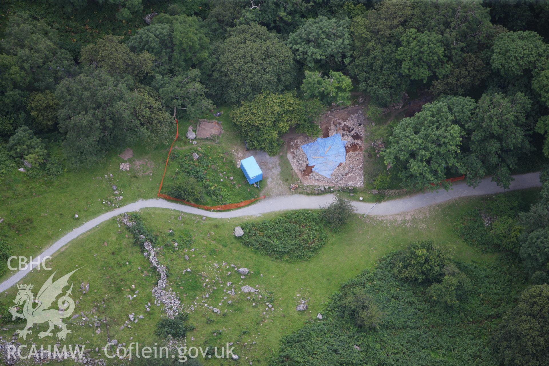 RCAHMW colour oblique aerial photograph of the excavated Hut Circle in Aber Valley. Taken on 06 August 2009 by Toby Driver