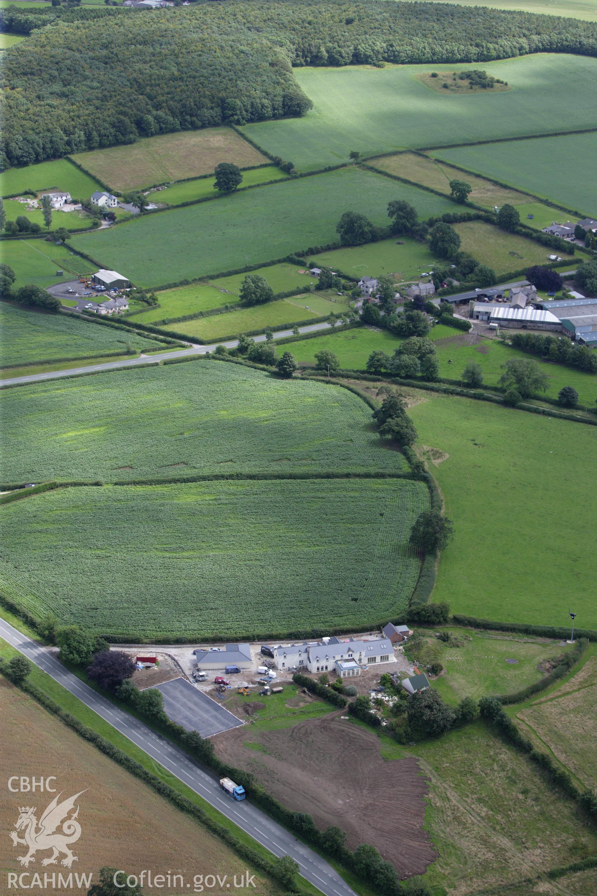 RCAHMW colour oblique aerial photograph of a section of Offa's Dyke, or Whitford Dyke, northwest and southeast of Brynbella Mound. Taken on 30 July 2009 by Toby Driver