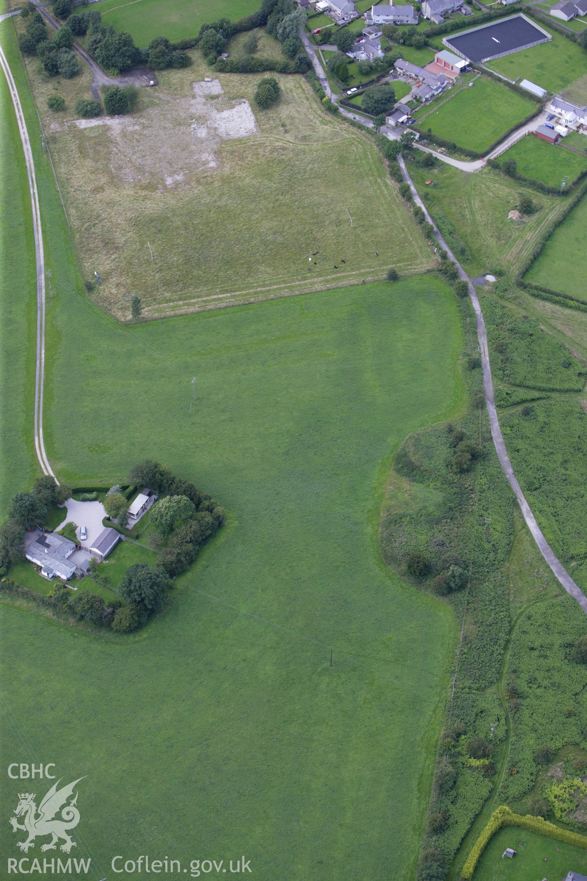 RCAHMW colour oblique aerial photograph of Eosfan Round Barrows A and B. Taken on 30 July 2009 by Toby Driver