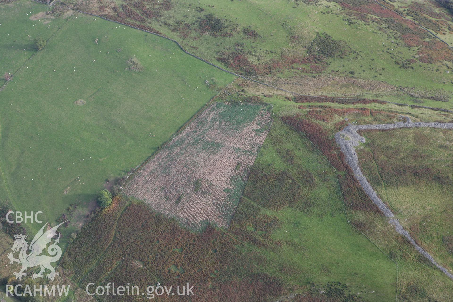 RCAHMW colour oblique aerial photograph of Caer Drewyn Settlement and Field System. Taken on 13 October 2009 by Toby Driver