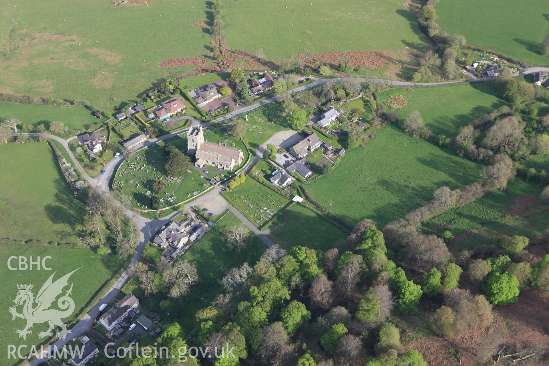 RCAHMW colour oblique aerial photograph of Old Radnor Castle, showing village and ringwork. Taken on 21 April 2009 by Toby Driver