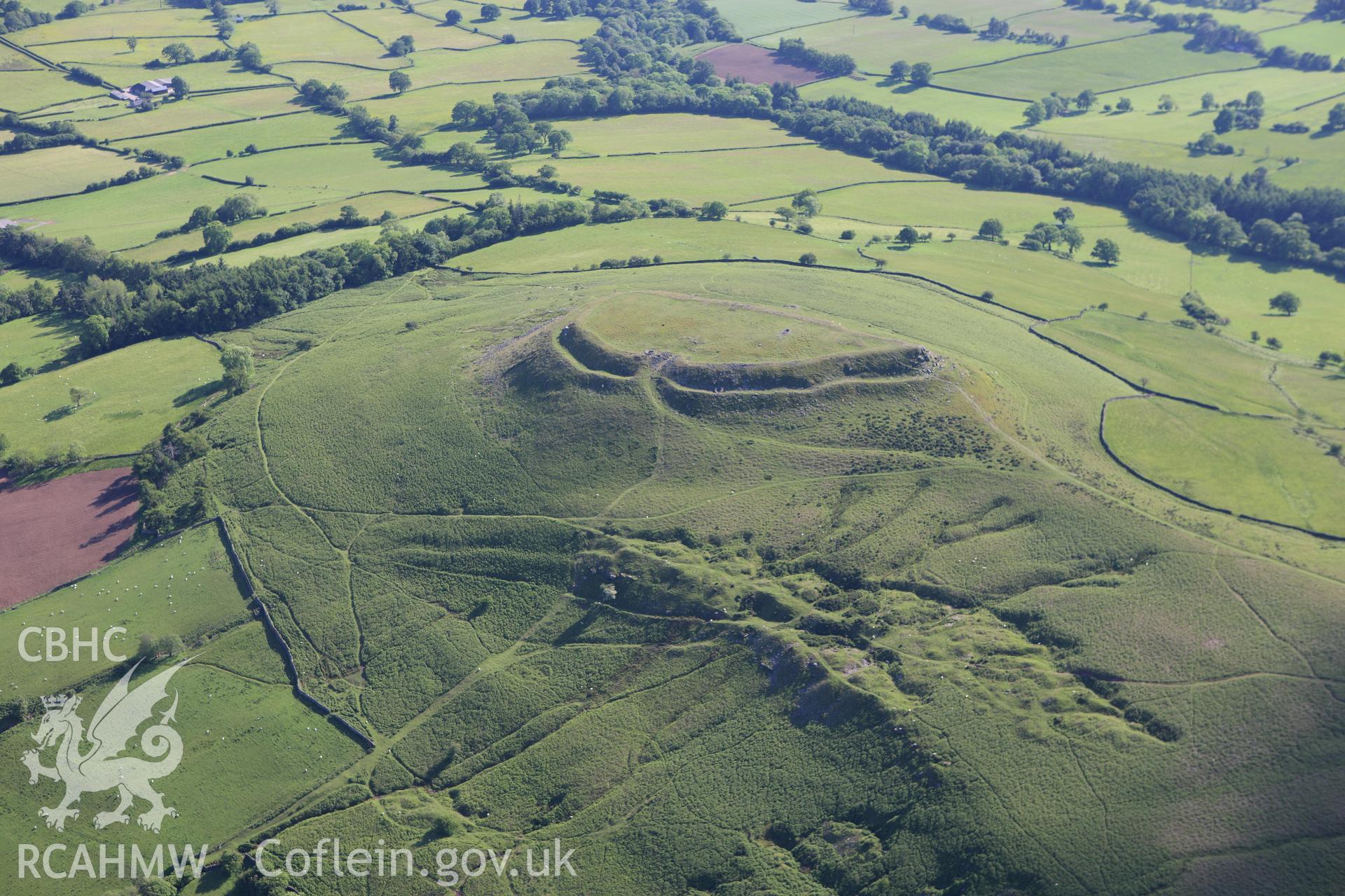 RCAHMW colour oblique aerial photograph of Crug Hywel Camp. Taken on 11 June 2009 by Toby Driver