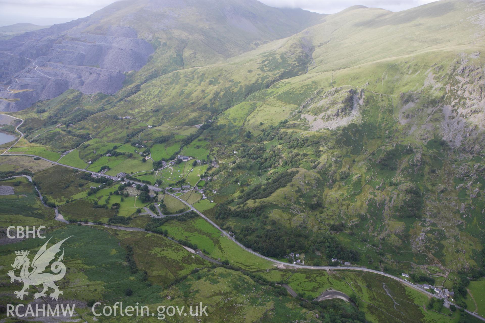 RCAHMW colour oblique aerial photograph of St Peris' Church and the Nant Peris landscape. Taken on 06 August 2009 by Toby Driver