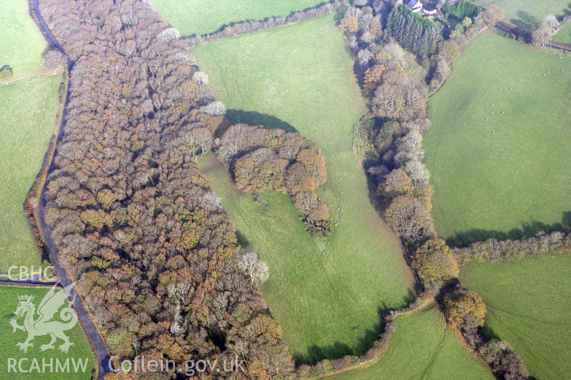 RCAHMW colour oblique aerial photograph of Tre-Coll Hillfort. Taken on 09 November 2009 by Toby Driver